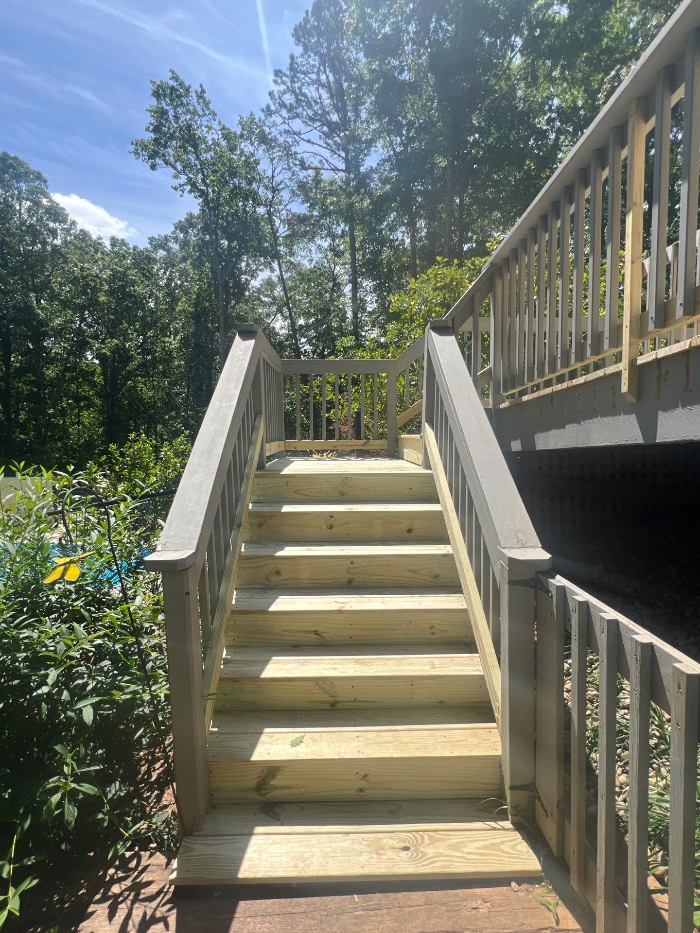 Pressure-Treated Wood Deck Resurfacing and Staircase Reconstruction in Canton by Swift Home Renovations
