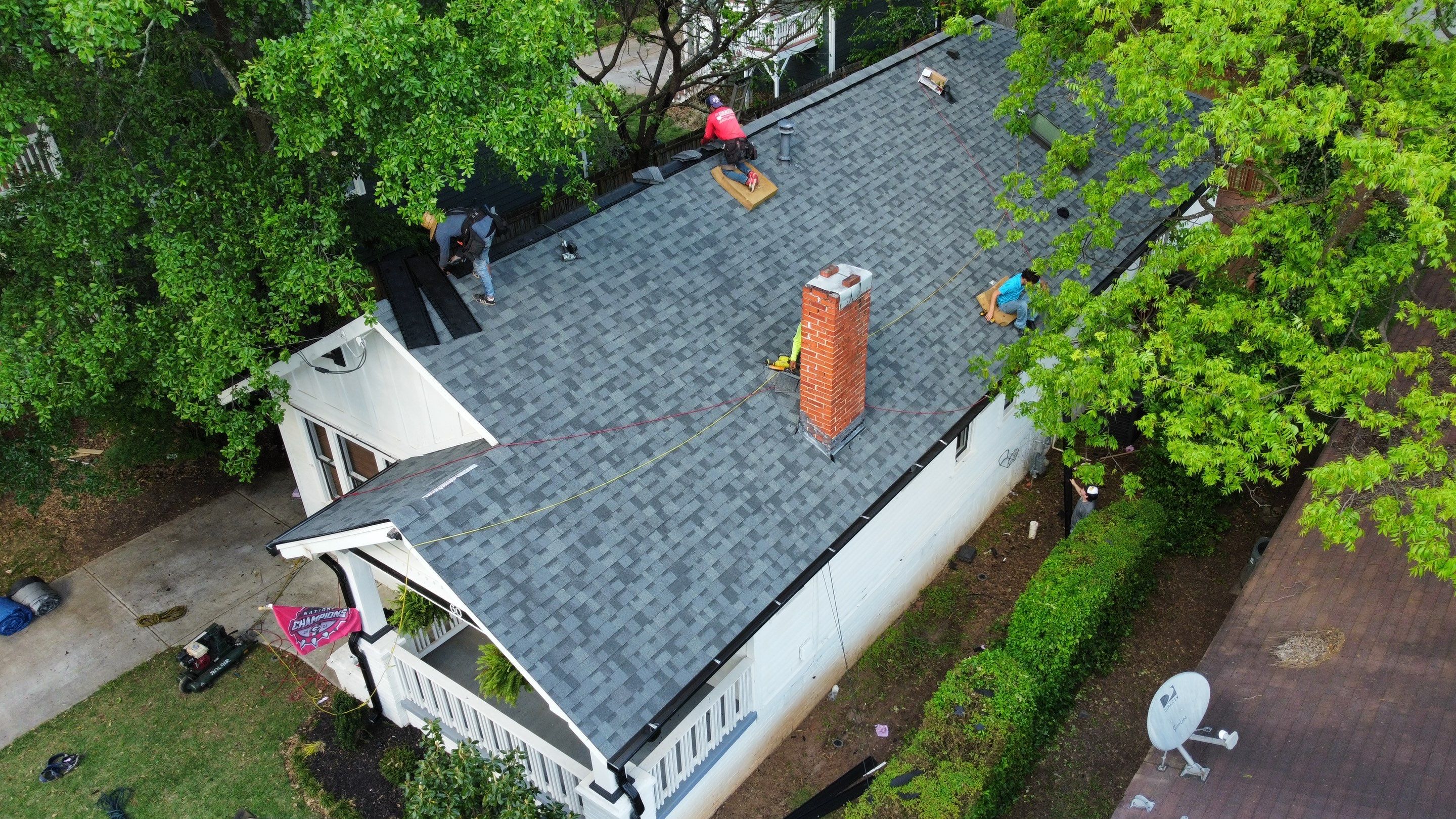 roof replacement and new black gutters by Nailed It Roofing & Remodeling LLC
