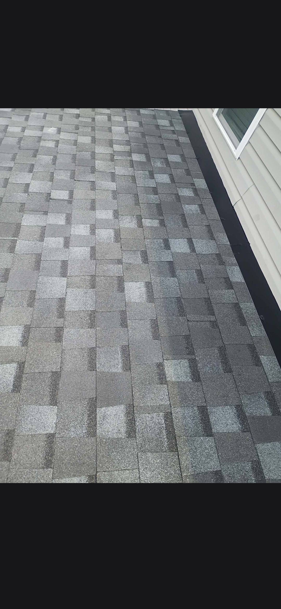 Covered Patio Roof Construction with Architectural Shingles in Garner by The Remodeling Company