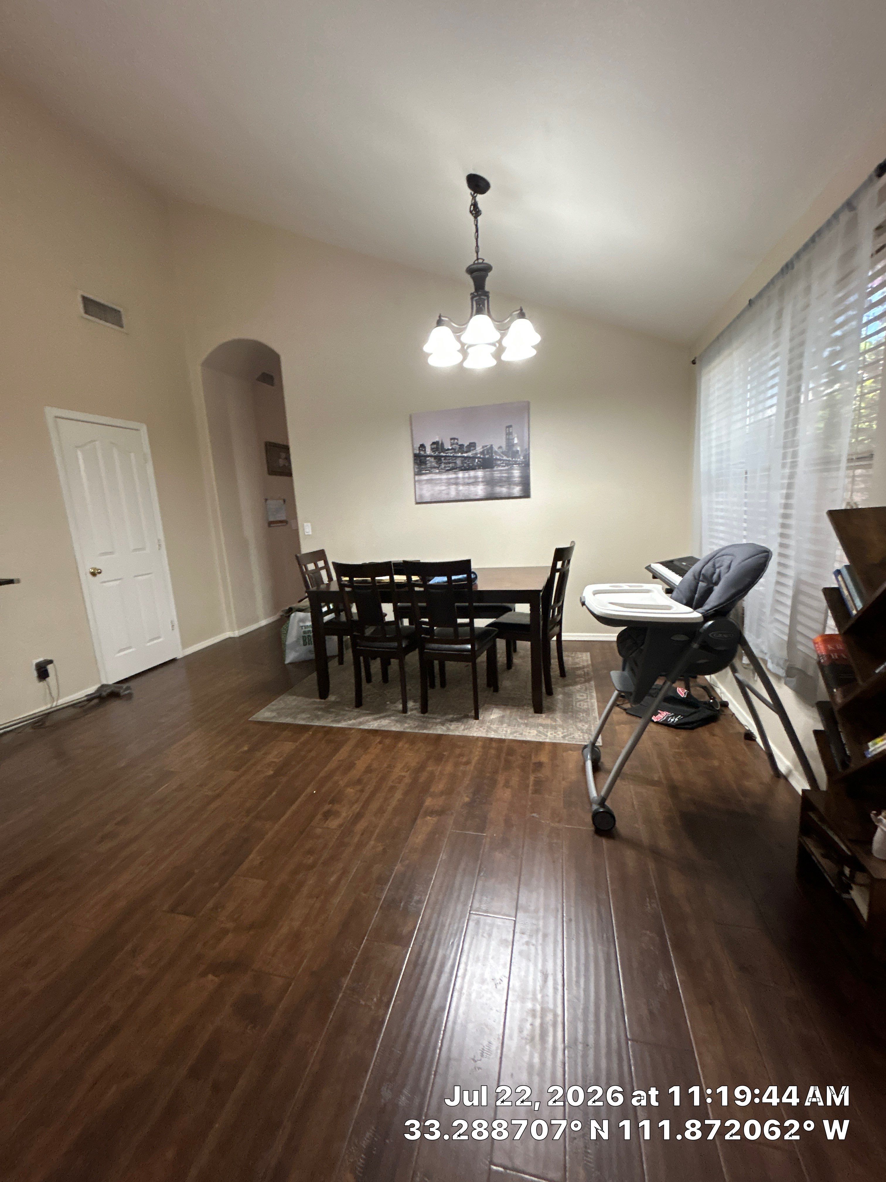 Chandler Dining Room Floor Remodel with Dark Wood-Look Laminate by CompanyCam Sales Demo