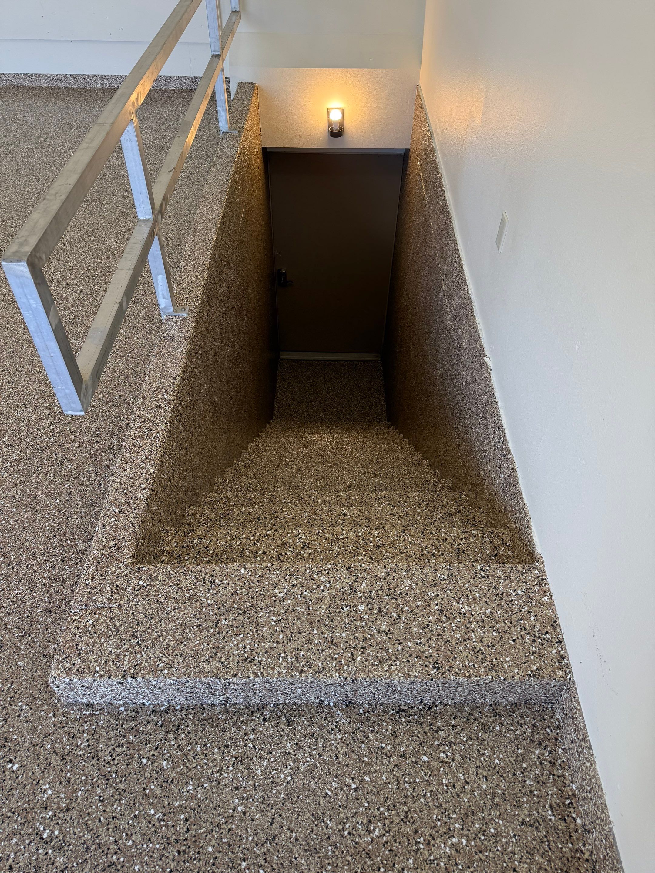 Custom Polyaspartic Garage Floor and Stairwell Coating in Pipestone by Select Painting, Coatings & Garage Cabinets