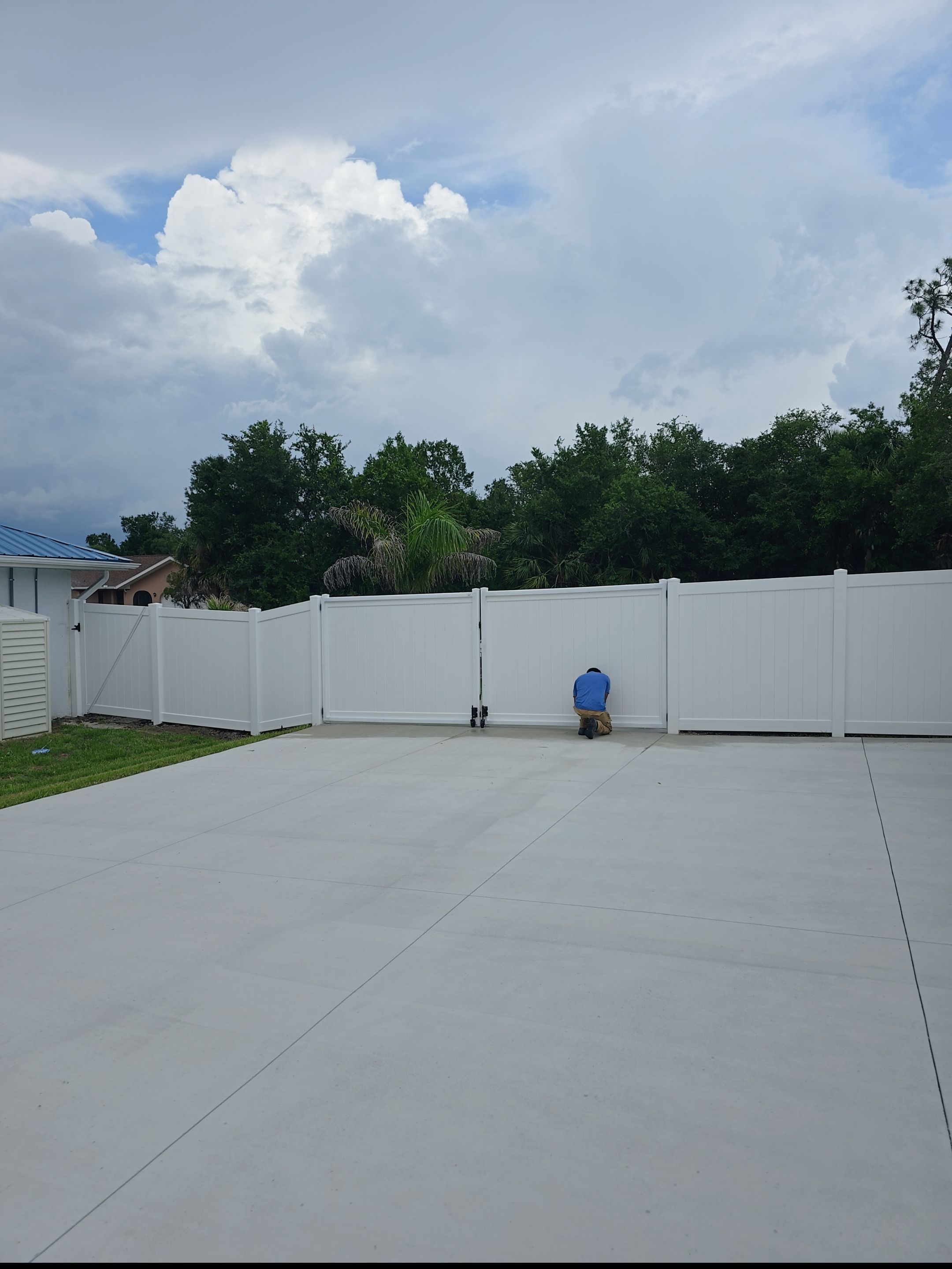 White Vinyl Privacy Fence Installation and Gate Repair in Port Charlotte by True Fence LLC
