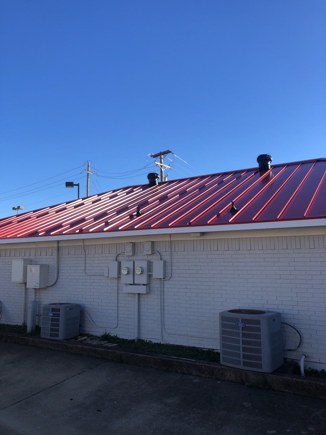 Commercial metal roof by Springtree Restoration 