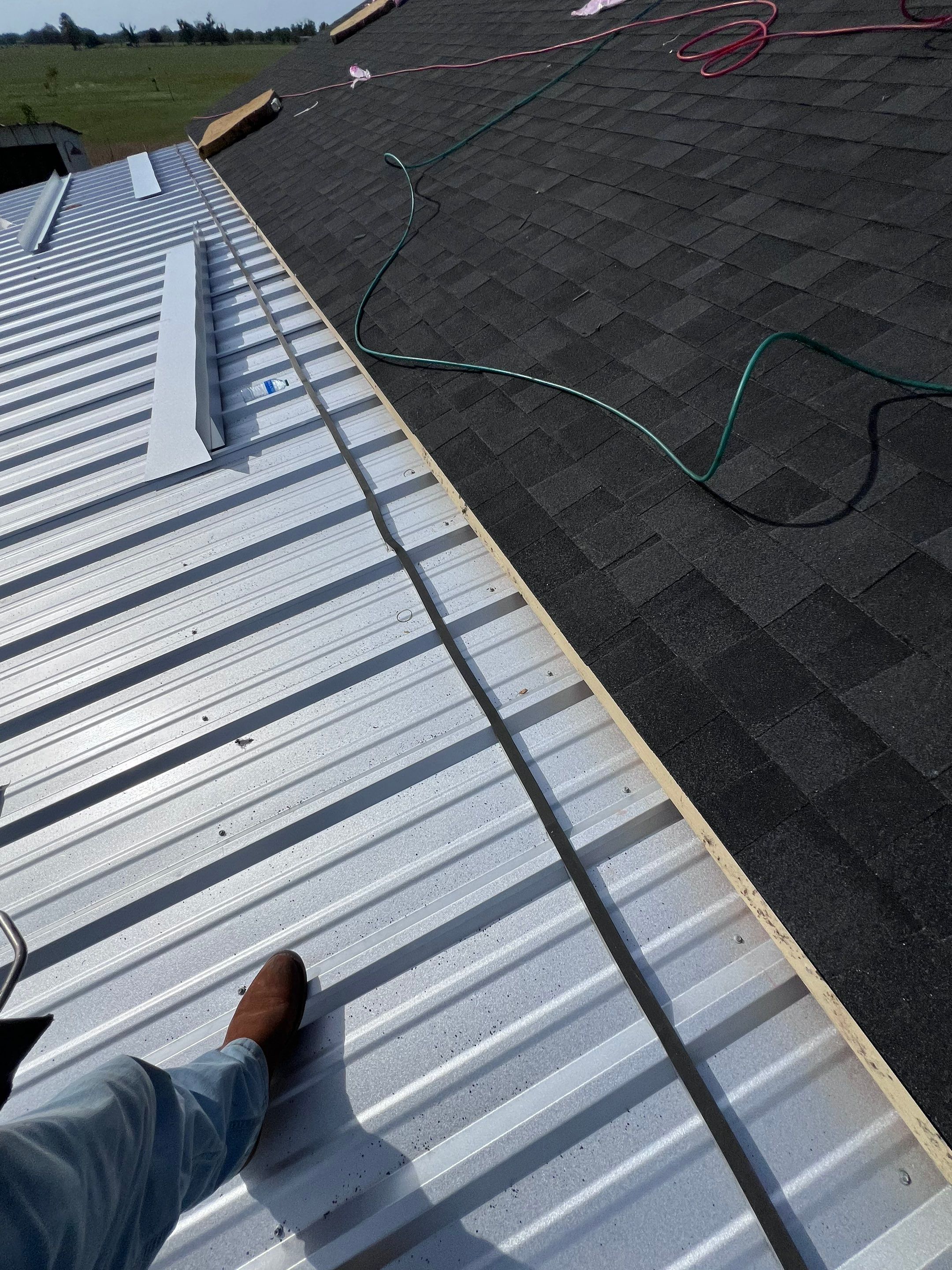 Residential Roofing Installation using Metal by Roof Repair Company