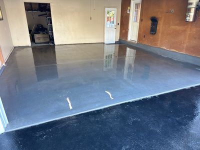 Concrete garage floor replacement and wall repair