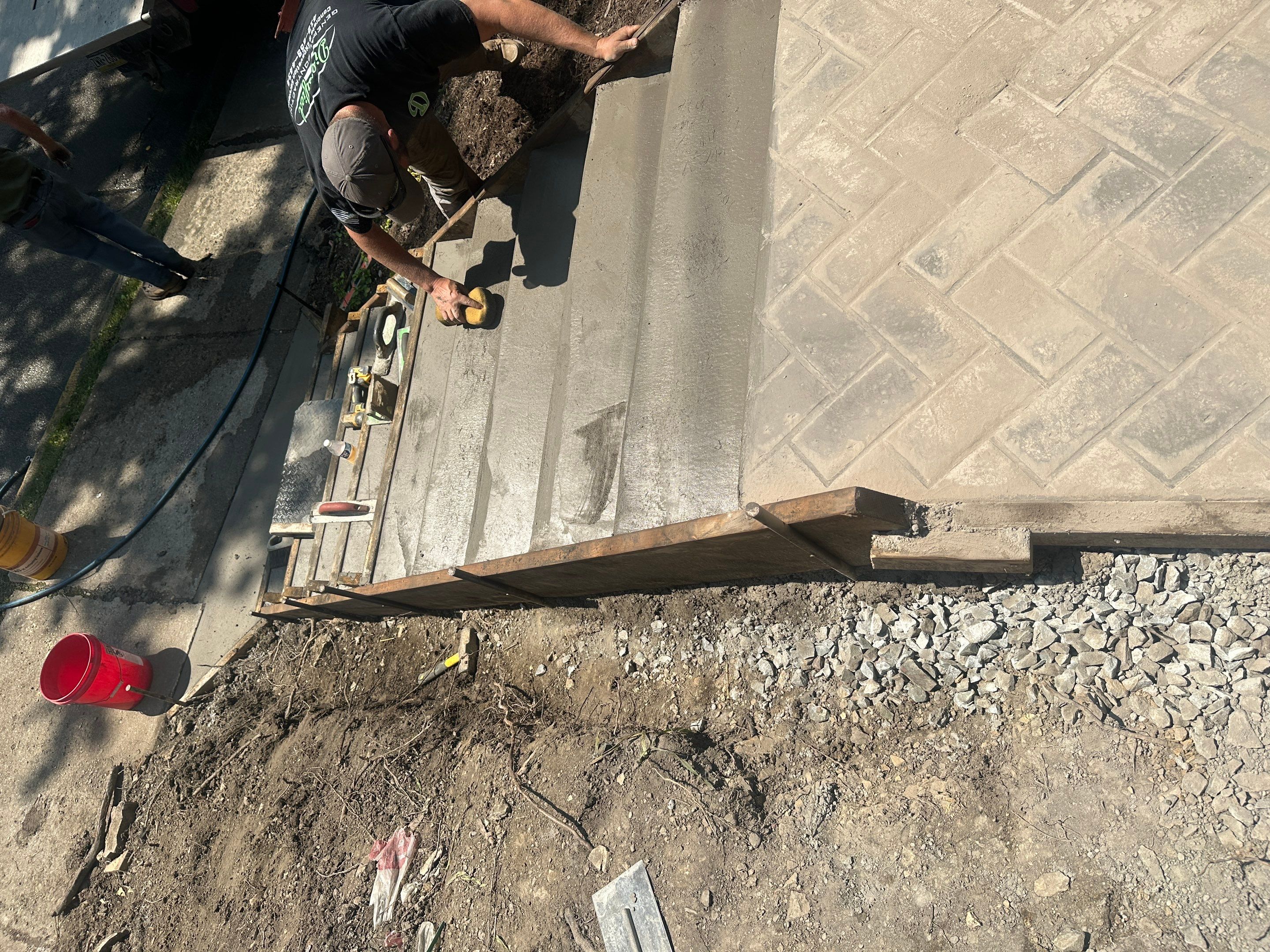 Stamped Concrete and Retaining Wall by Cousins Roofing Siding & Decks