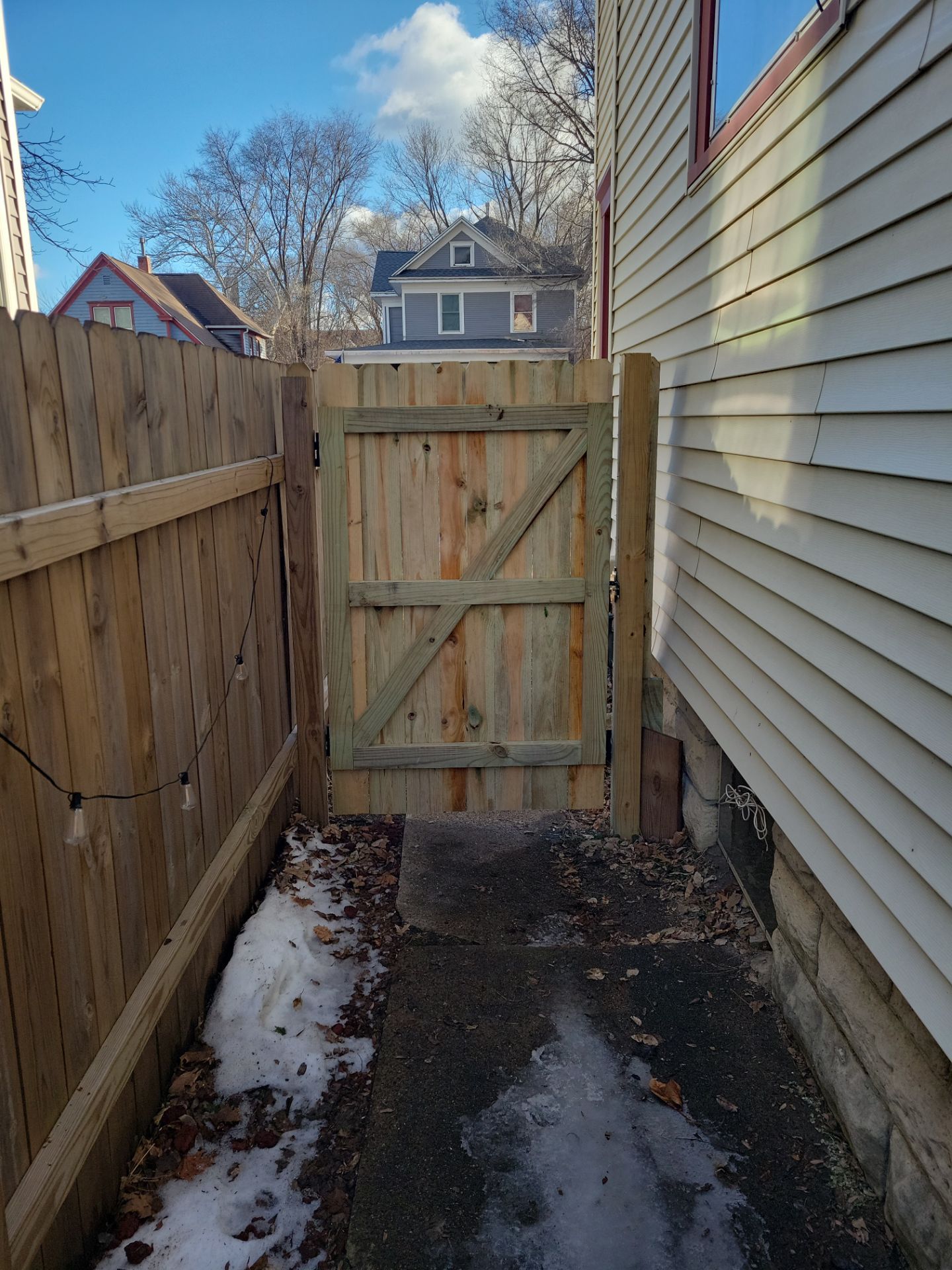 Pressure-Treated Wood Privacy Fence and Double Gate Installation in Waterloo by Perfect Picket Fence and Stain