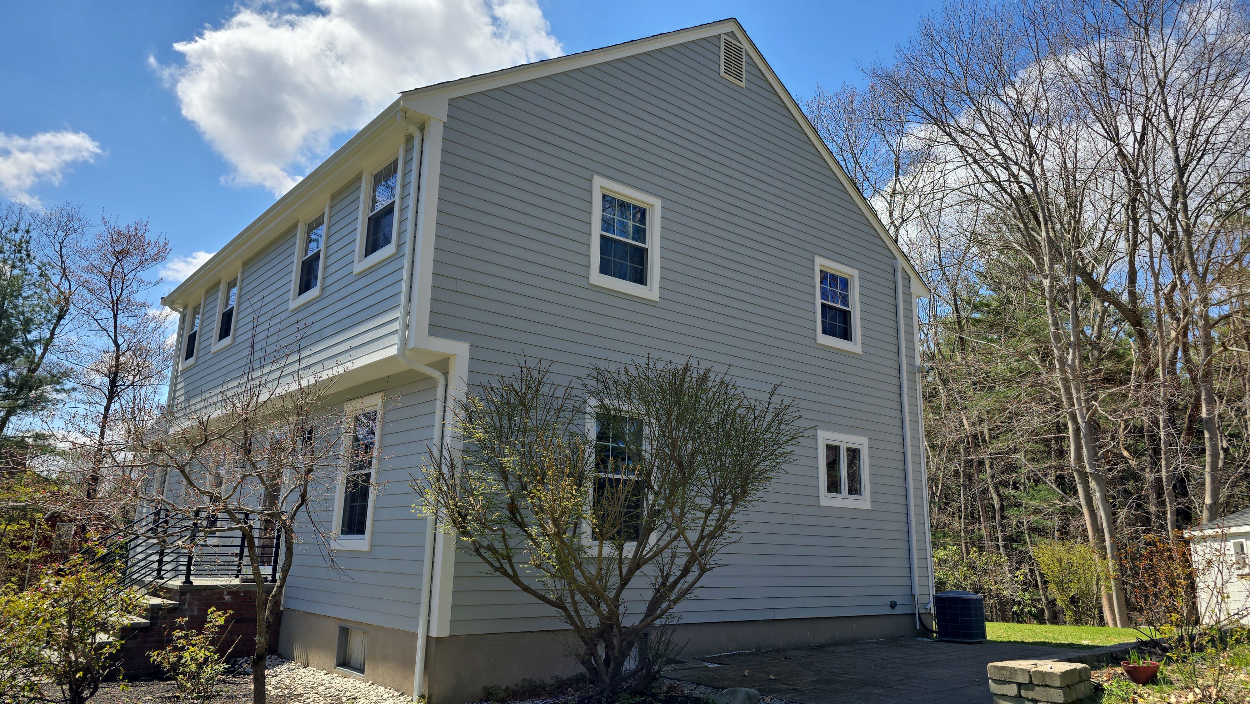 Custom window trim work and siding replacement in Dover, MA by UBrothers Construction