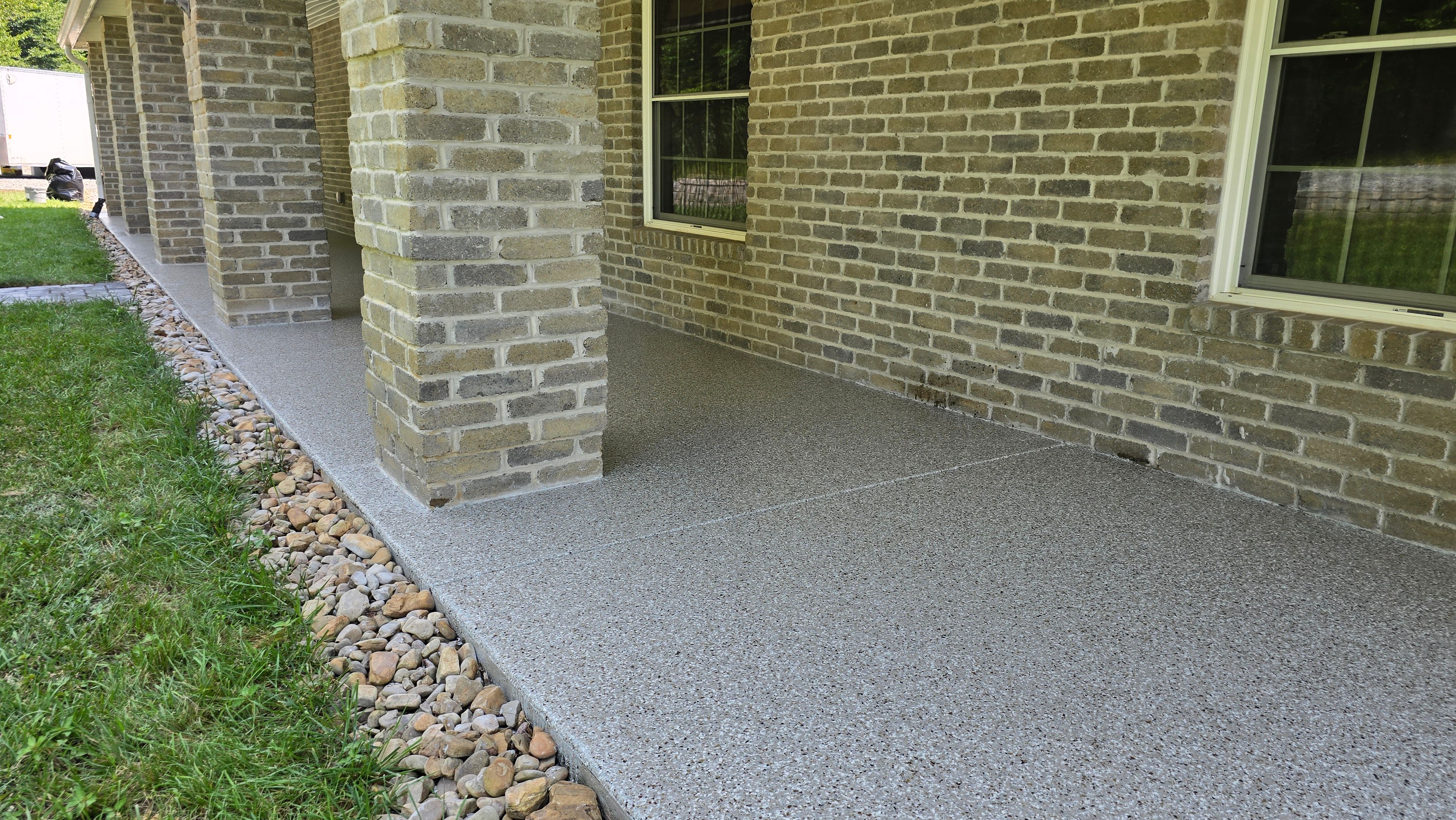 Back Patio using Creekbed by Elite Floor Solutions