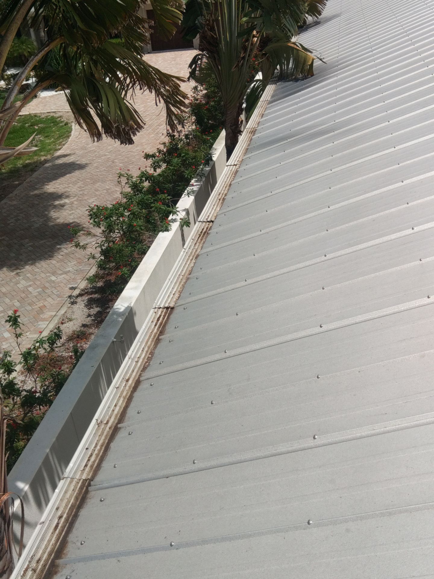 Gutter guards installation combined with gutter cleaning in Sarasota, FL by Gutter Professors