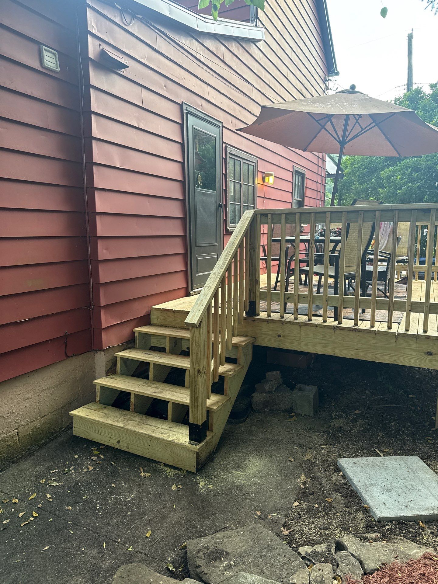 Roof sunspace deck  by Cousins Roofing Siding & Decks