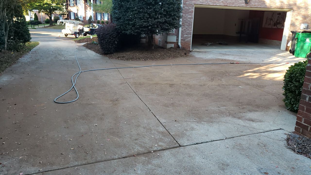 Driveway Clean using cleaner by Power Wash Masters LLC