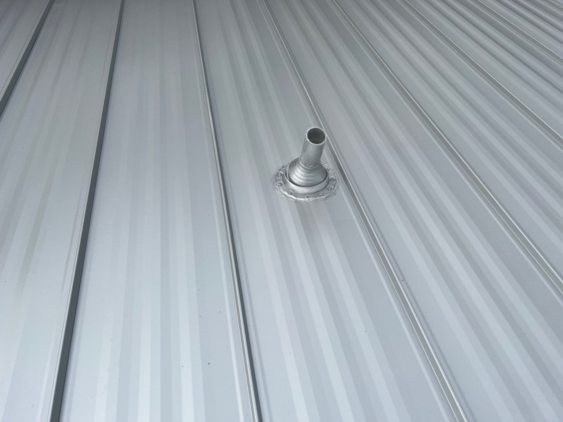 Residential Roofing Installation using Galvalume Standing Seam by Durabilis Roofing INC