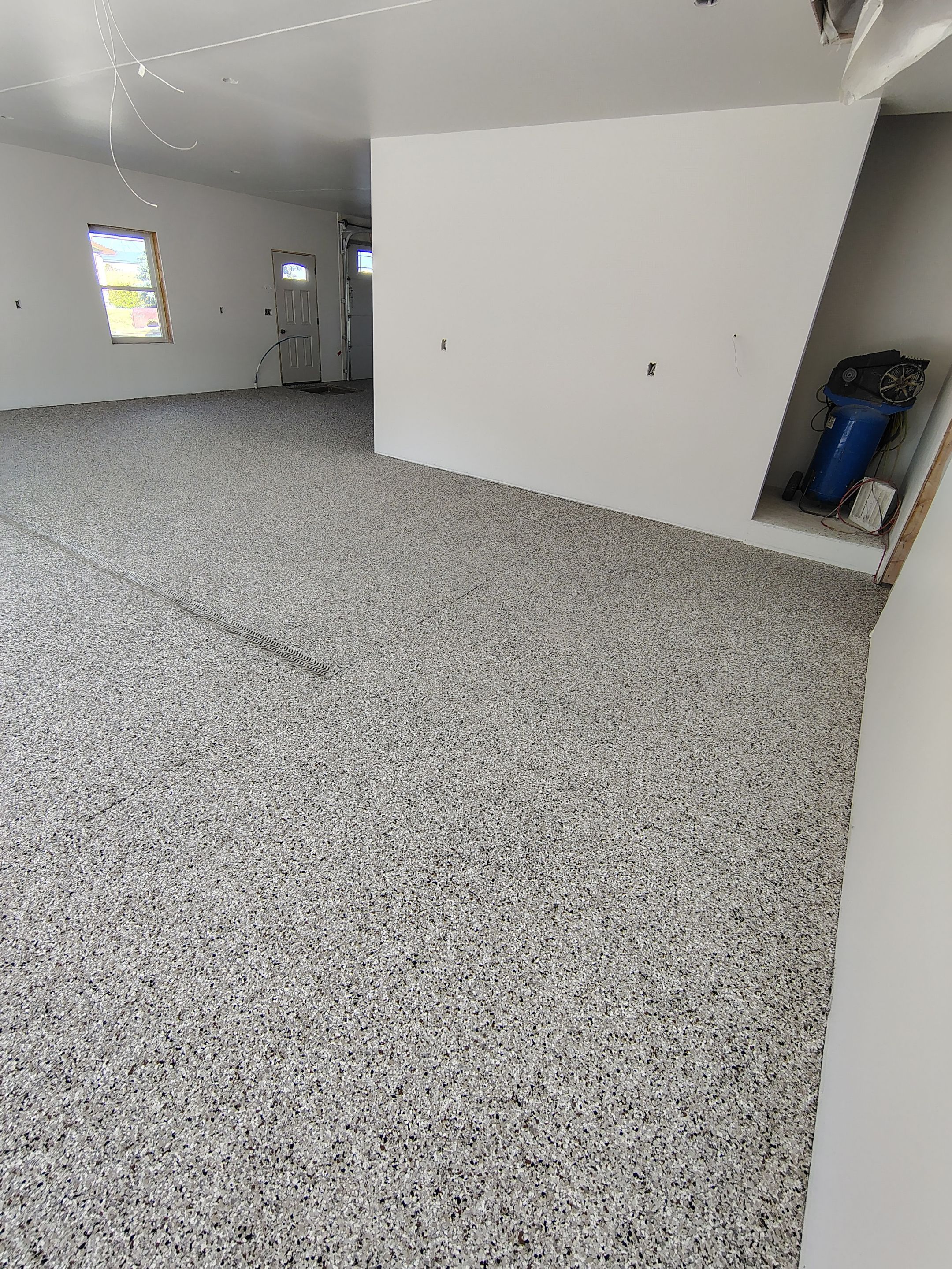 Custom Garage and Basement Epoxy Floor Coating in Menno by Select Painting, Coatings & Garage Cabinets