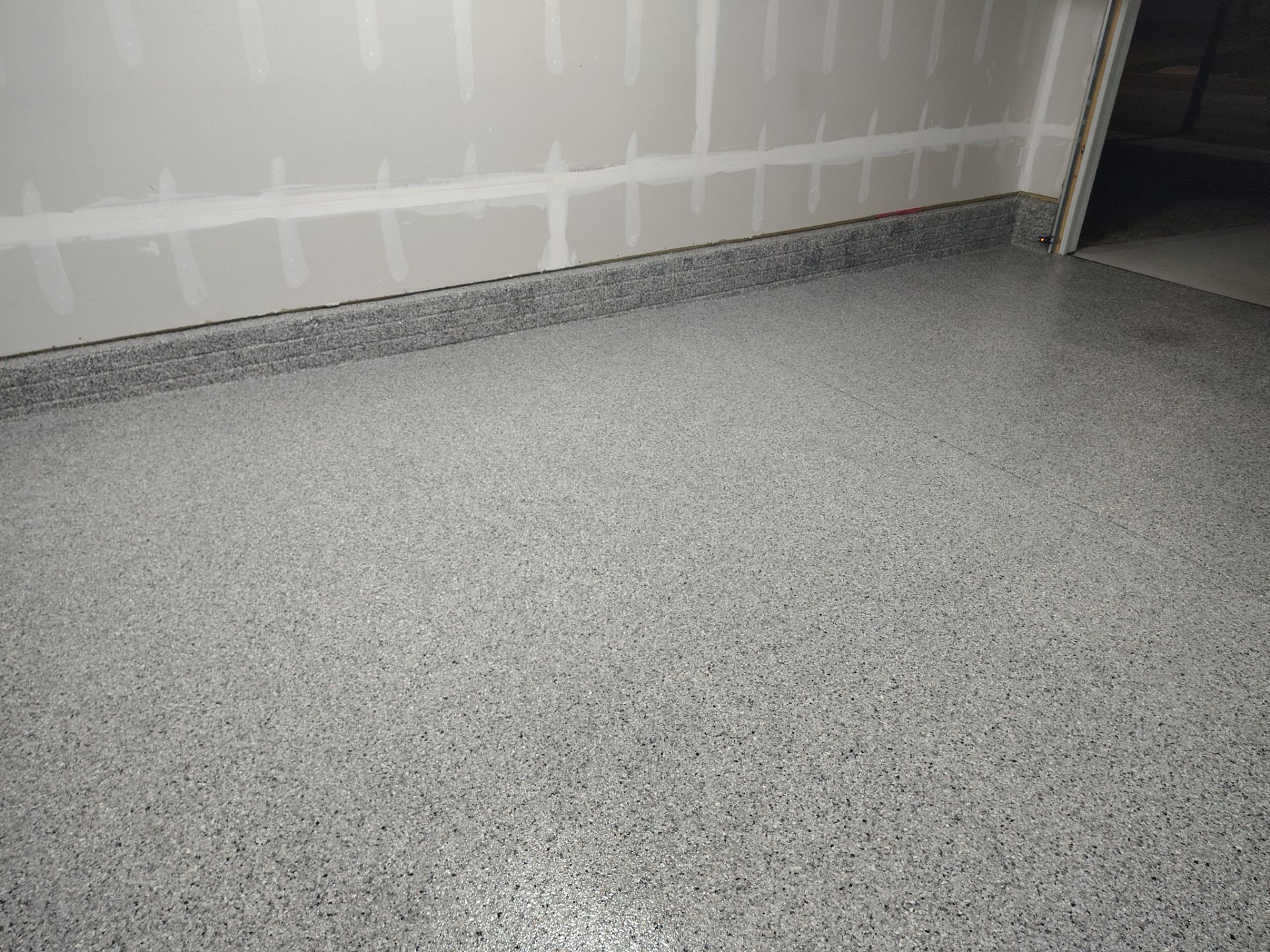 Adel, IA Garage: Complete Keystone Wrap on Floors, Stairs, and Stem Walls by Revival Concrete Coatings
