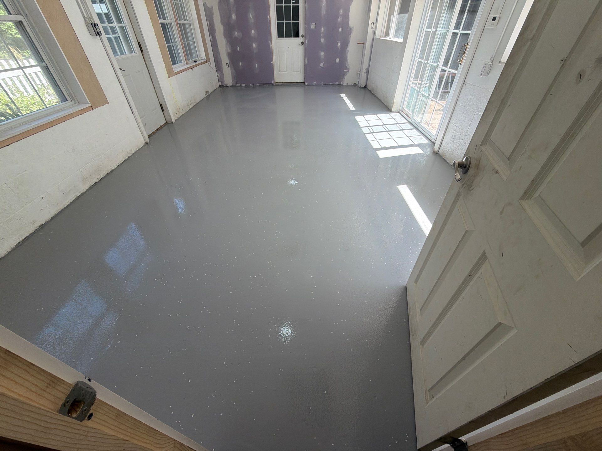 Grey Epoxy Flake Floor Installation for a Muskegon Sunroom by Gordon Painting