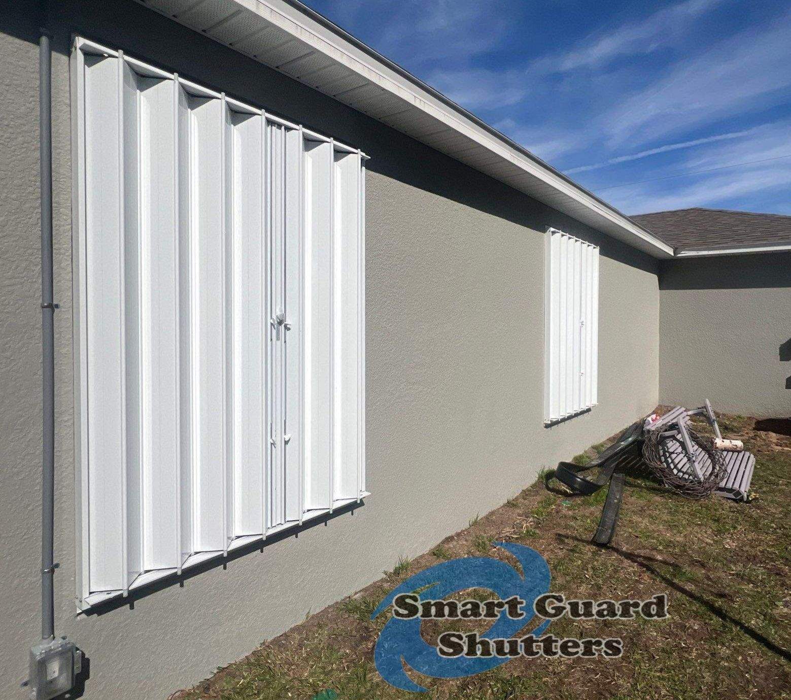Accordion Shutters in White by Smart Guard Shutters