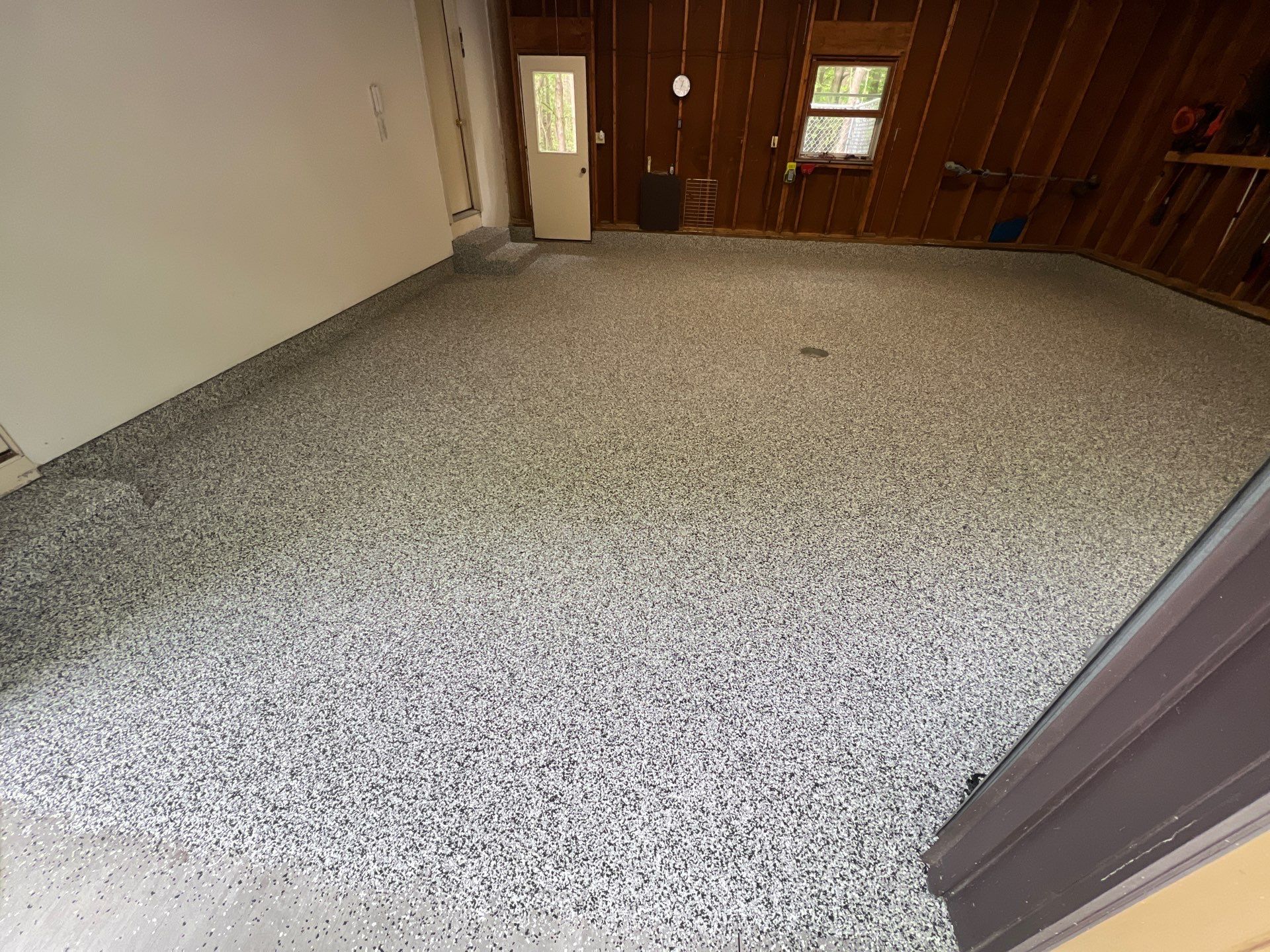 Grand Haven Garage Floor Renovation with Epoxy Flake Coating by Gordon Painting
