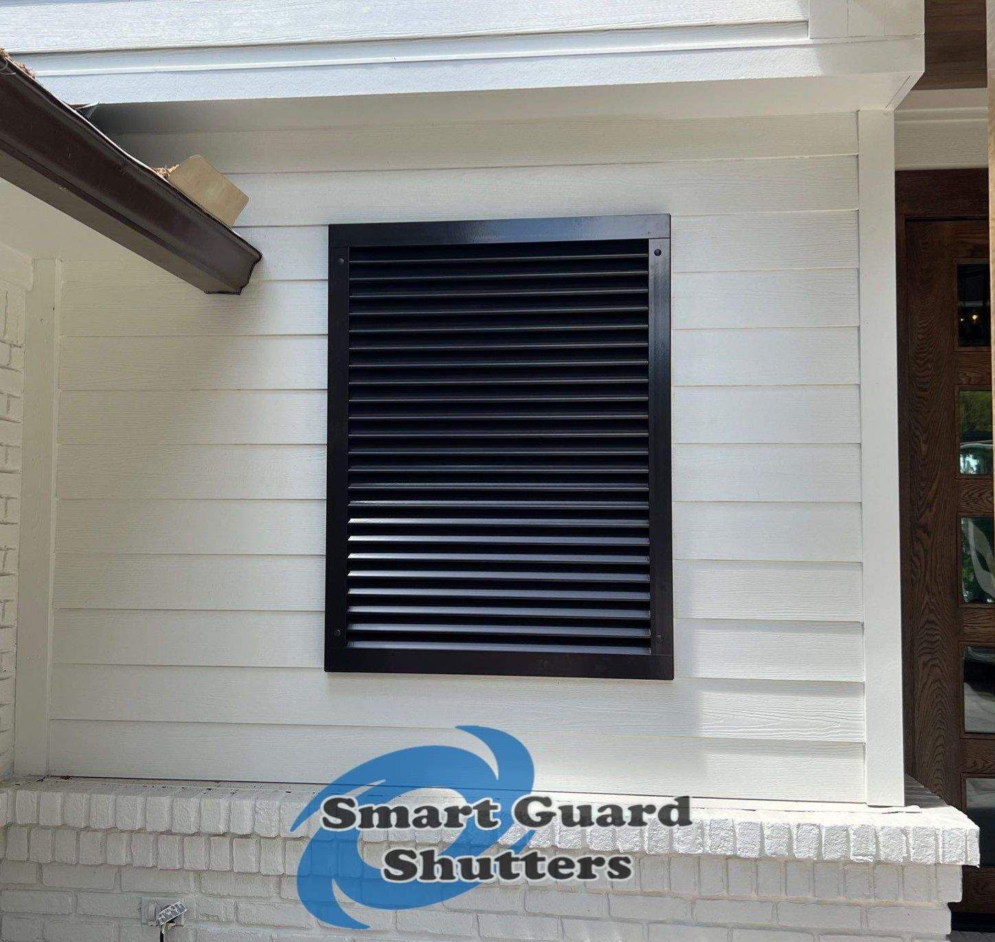Impact Colonial & Bahama Shutters in Jet Black by Smart Guard Shutters