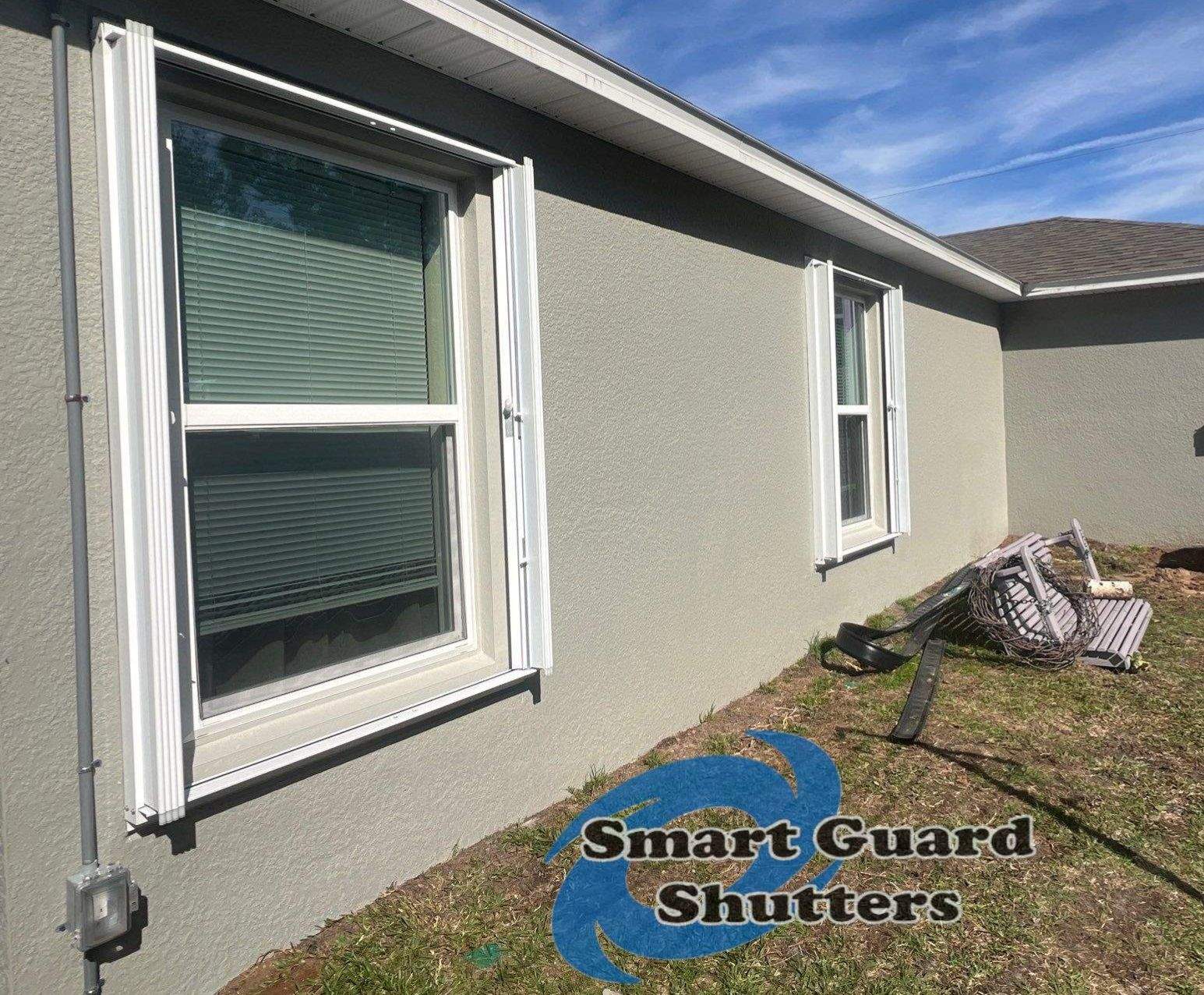Accordion Shutters in White by Smart Guard Shutters