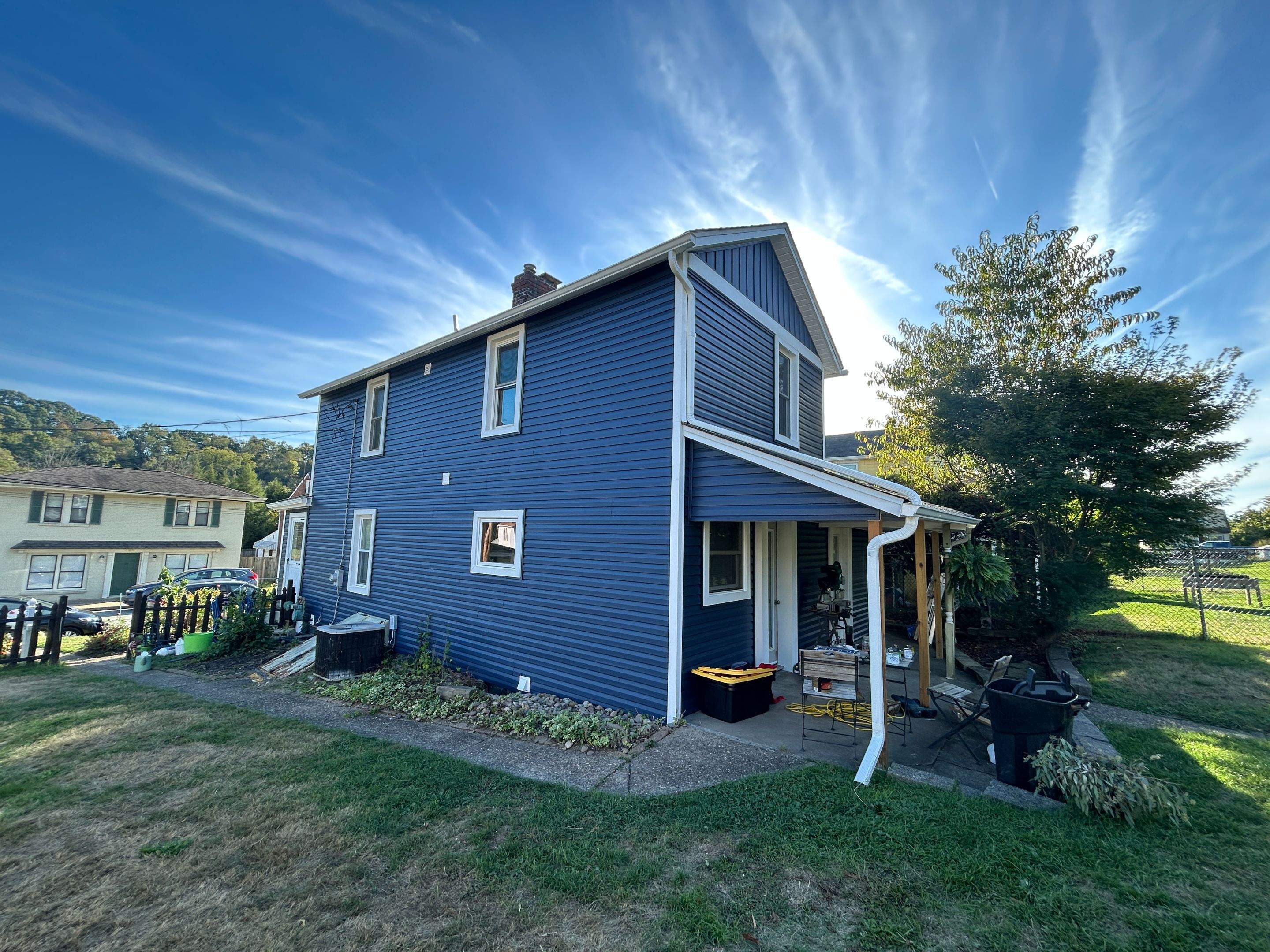 House Siding Renovation with White Vinyl in Bridgeville by Ideal Siding Pittsburgh