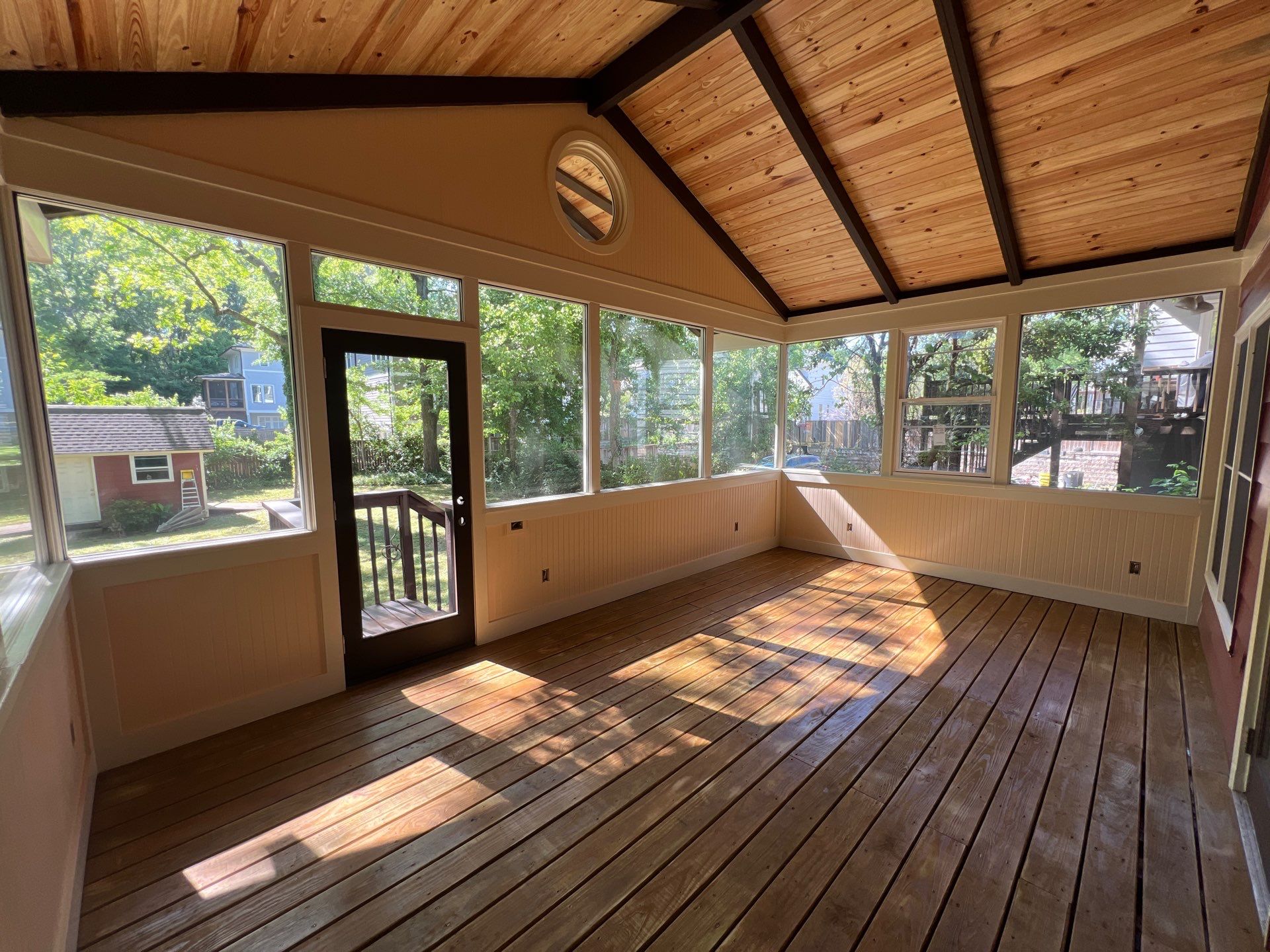 Elevated Screened-In Porch Addition with Vaulted Tongue-and-Groove Ceiling by Swift Home Renovations