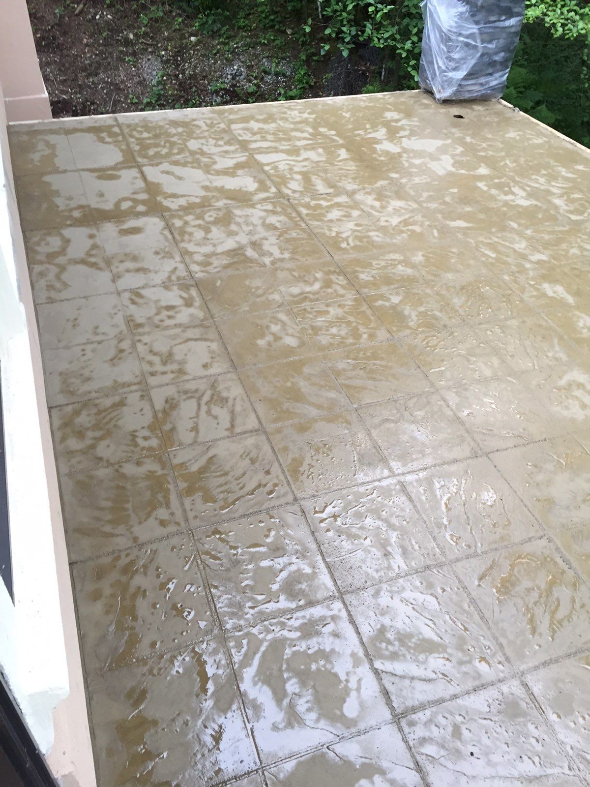 Asphalt Driveway and Stamped Concrete Patio Finish  by Jireh Asphalt & Concrete Inc 