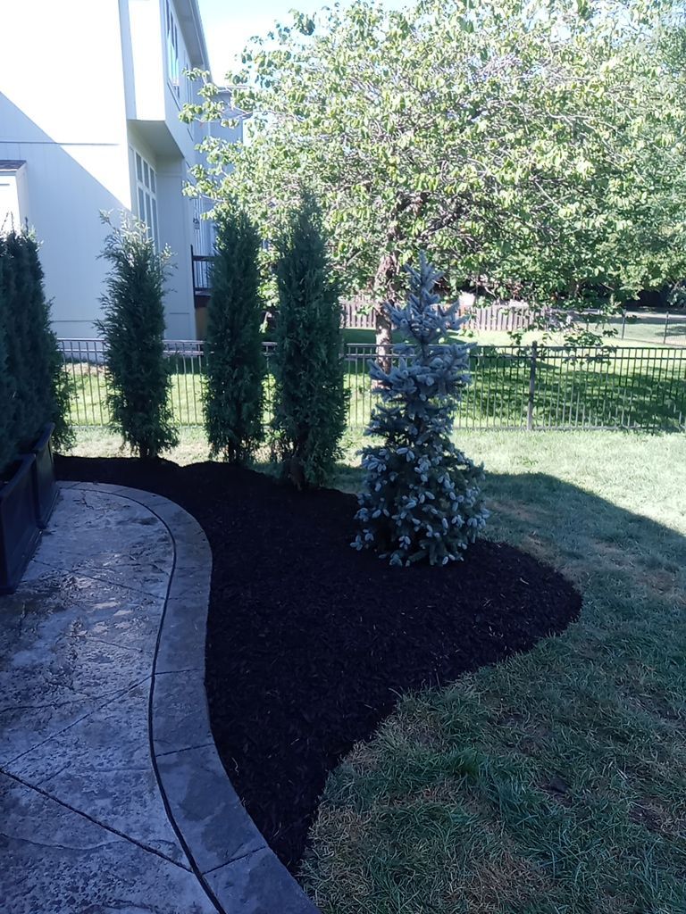 Back Yard Fireplace and Landscape by LAND ESCAPES LLC