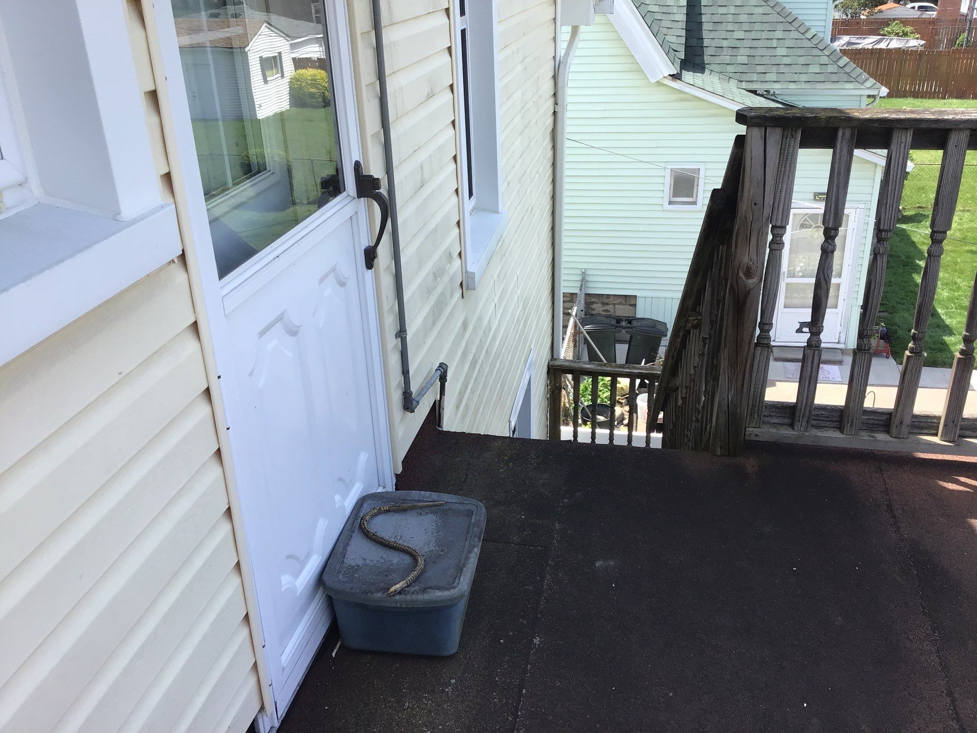 Rebuild balcony flat roofing TREX decking stairway and Railings in Wyandotte, MI by Northwest Construction 