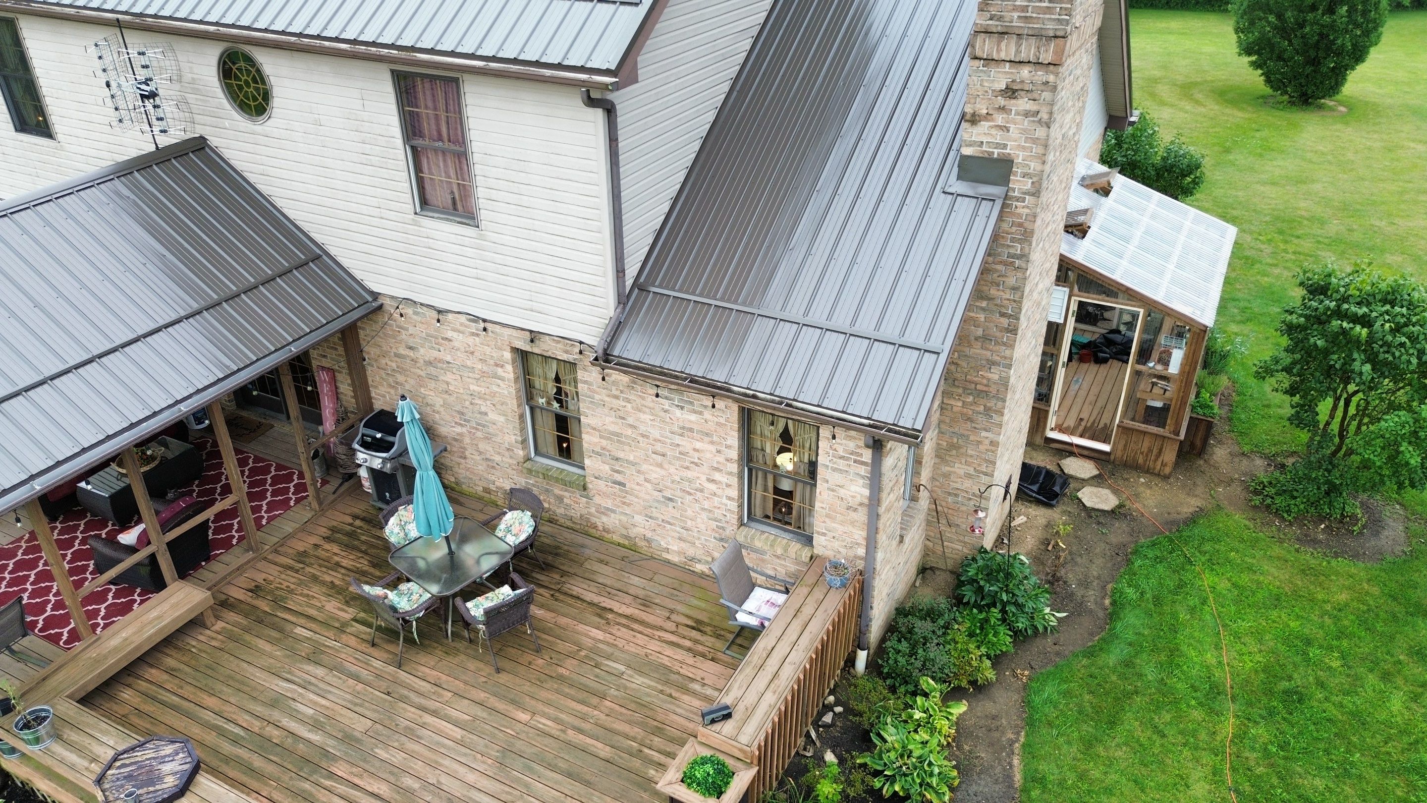 Residential Roofing Installation using Performance Panel Metal - Burnished Slate by RoofX 
