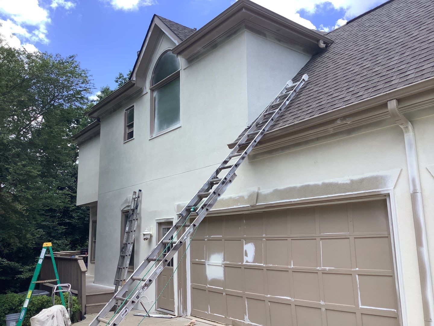 Stucco Exterior Painting and Deck Refinishing in Duluth by Swift Home Renovations
