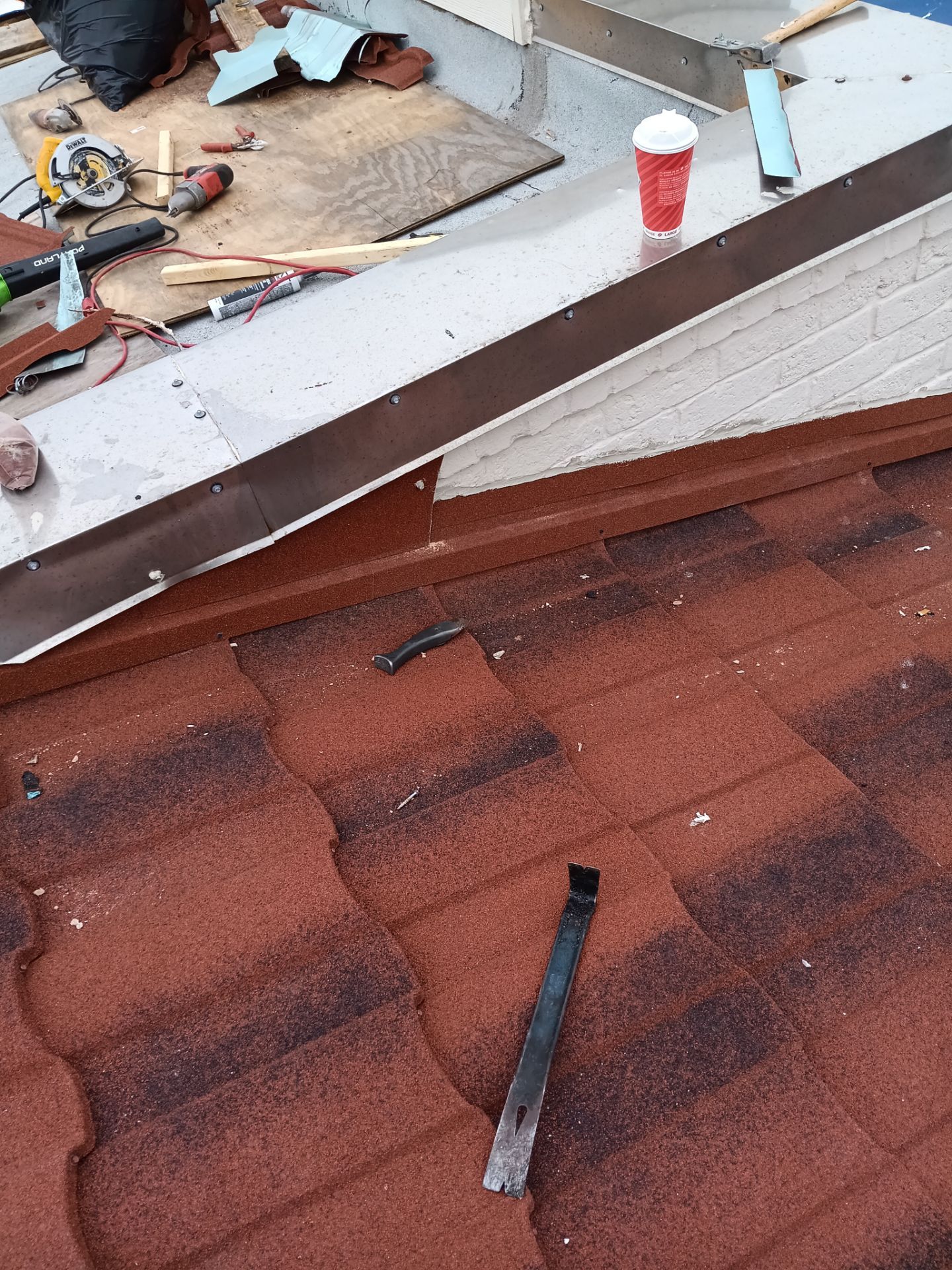 Off with the Tile and on with the TILCOR stone coated metal.  by Bayfront Roofing and Construction