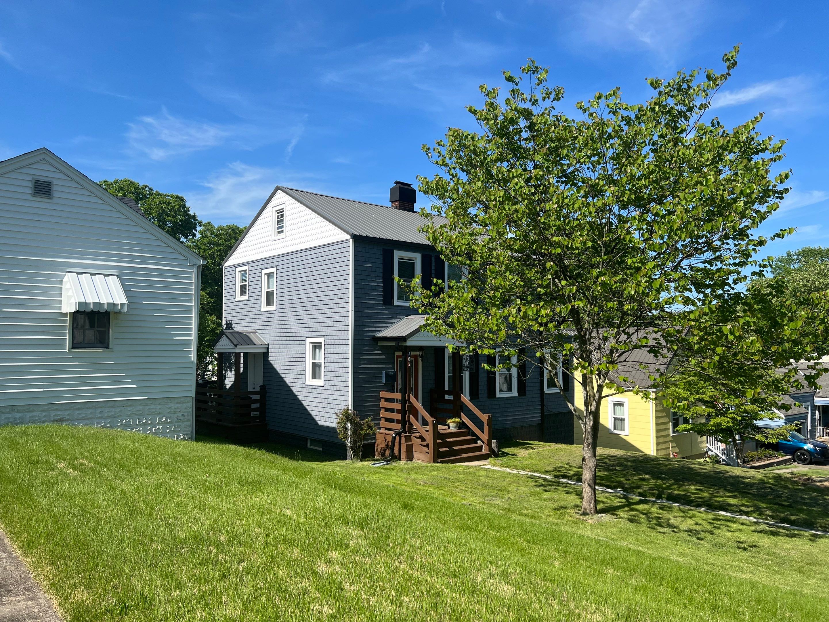 Siding Installation using Exterior Portfolio Portsmouth Vinyl Cedar Shakes by Secure Construction Company Inc