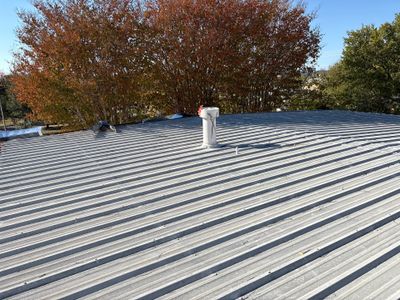 Wide view of a completed corrugated metal roof