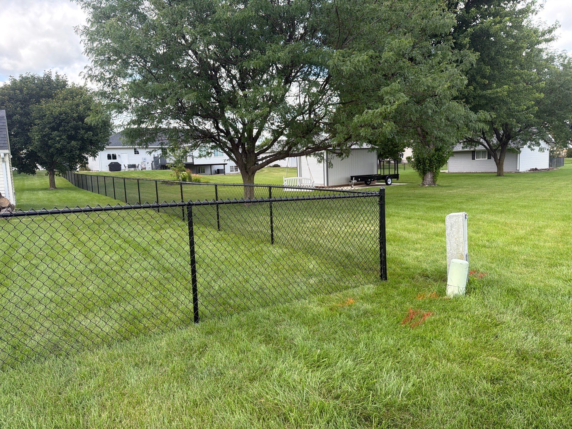 Black Vinyl-Coated Chain Link Fence Installation in Fairbank by Perfect Picket Fence and Stain