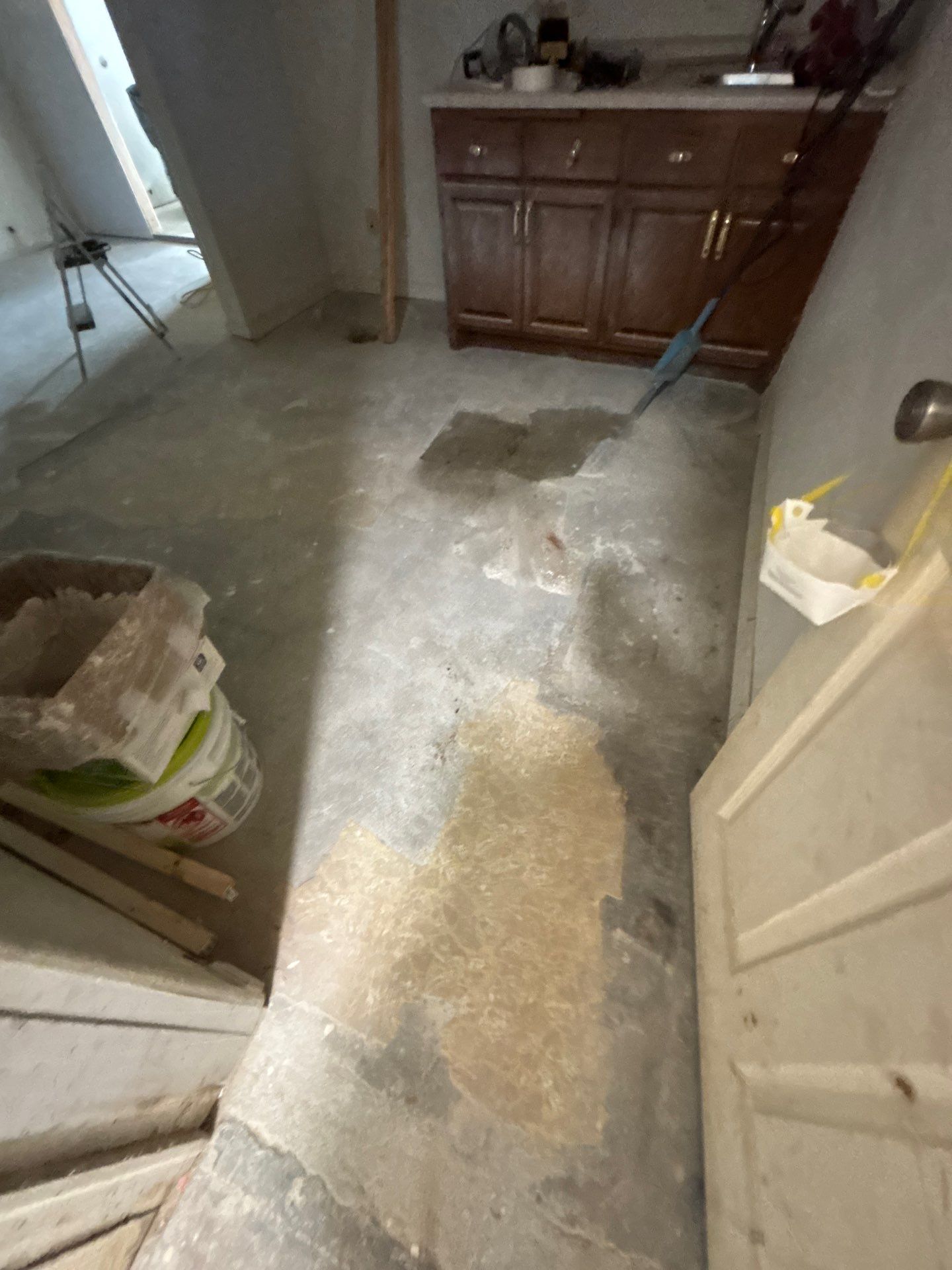 Comprehensive Basement Concrete Floor Coating and Crack Repair in Sioux Falls by Select Painting, Coatings & Garage Cabinets