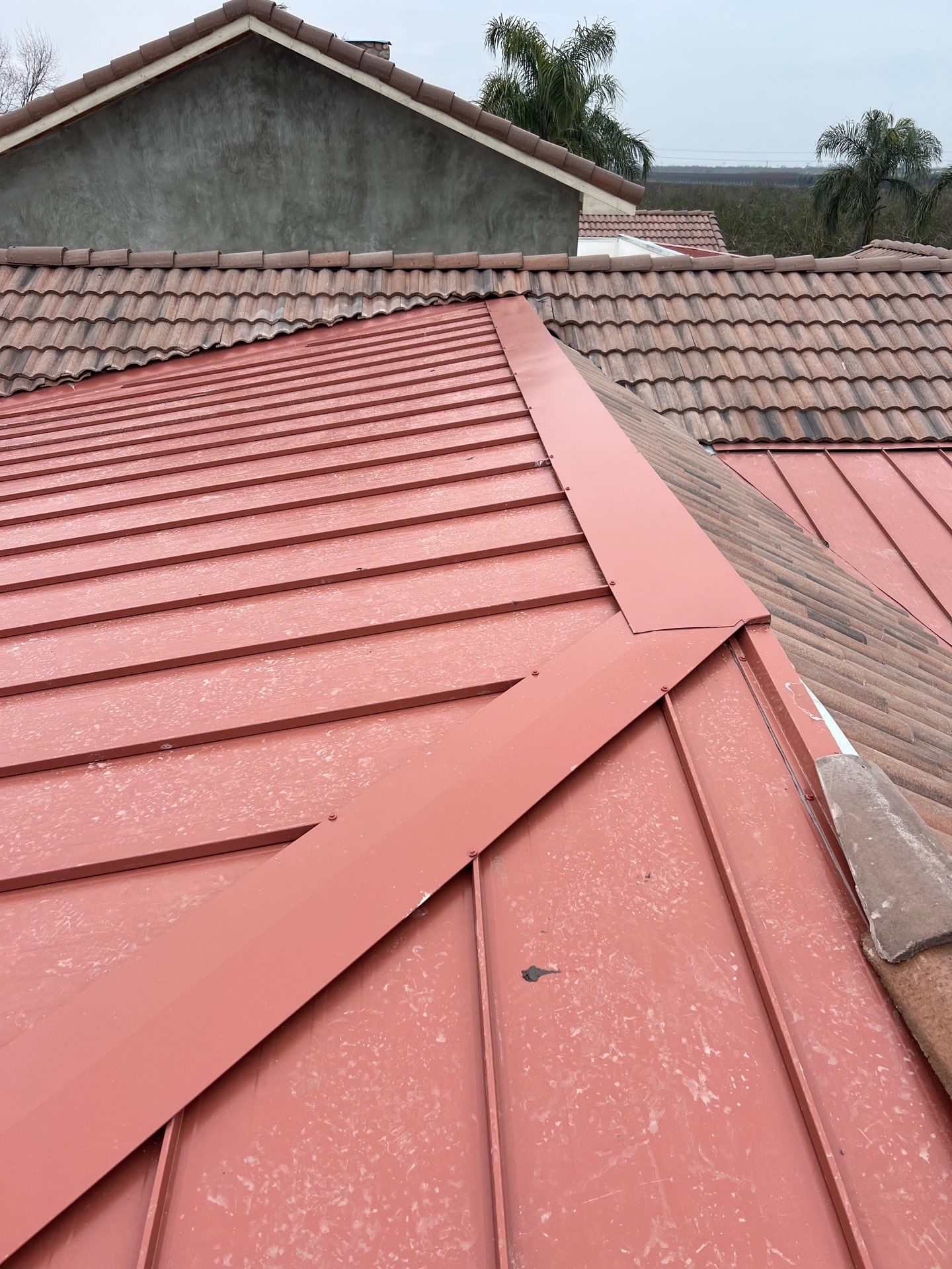 Tile, Metal, and TPO roofing project (new construction) by Straight Edge Roofing Inc