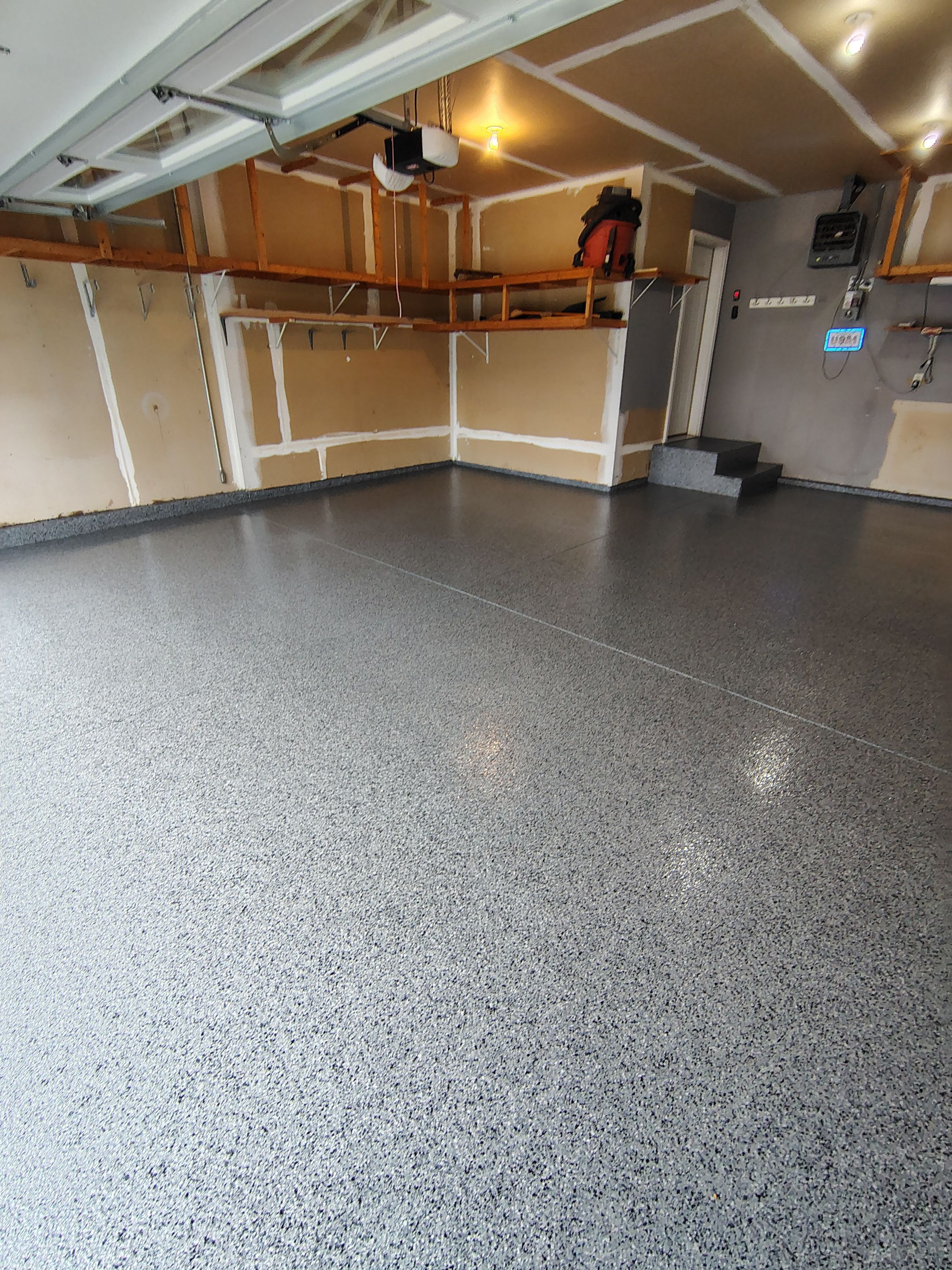 Nightfall Grey Speckled Epoxy Garage Floor Coating in Sioux Falls by Select Painting, Coatings & Garage Cabinets