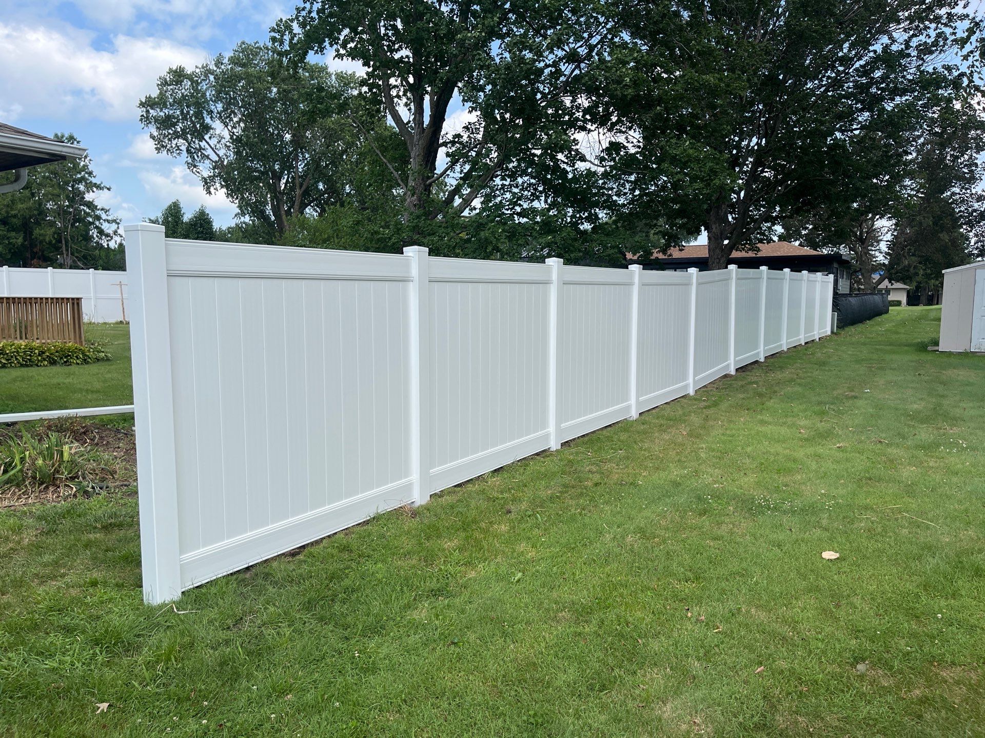 White Vinyl Privacy Fence Installation in Cedar Falls by Perfect Picket Fence and Stain