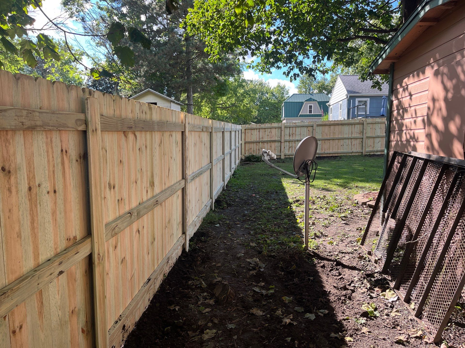 Pressure-Treated Wood Privacy Fence Installation in Waverly, Iowa by Perfect Picket Fence and Stain