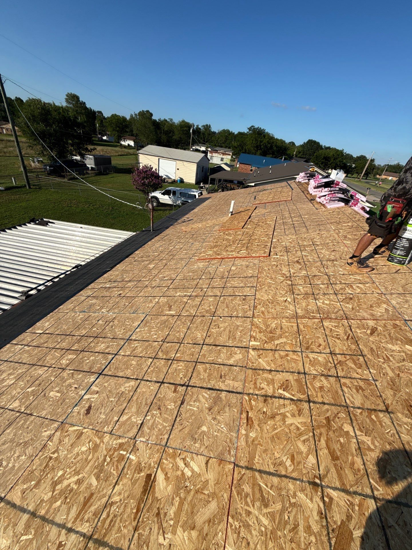 New roof & siding paid by insurance. Along with new roof sheathing.  by In & Out Construction & Remodeling, LLC