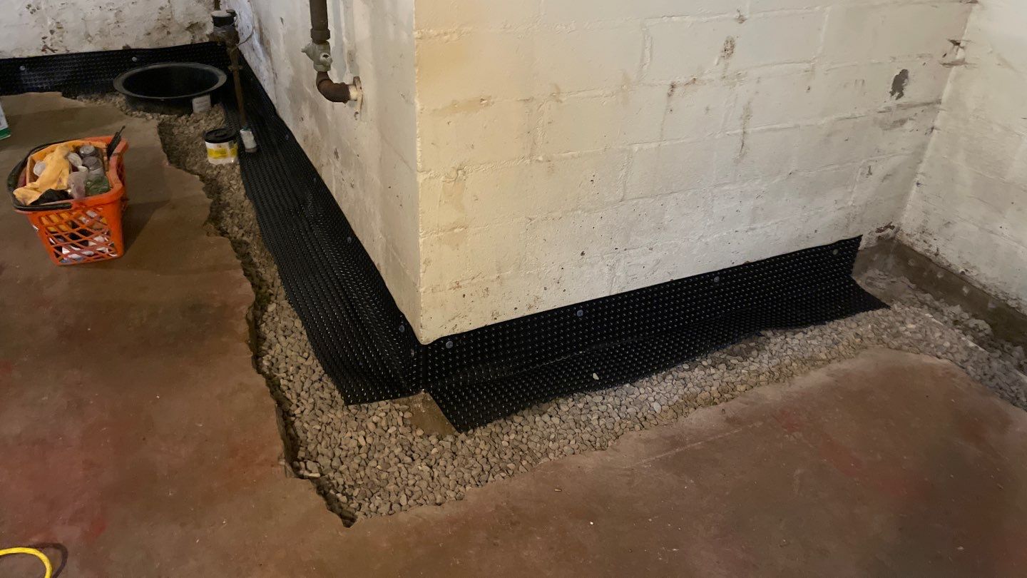 Interior Drain Tile & Sump Pump System in North Minneapolis by Waterproofing Northeast