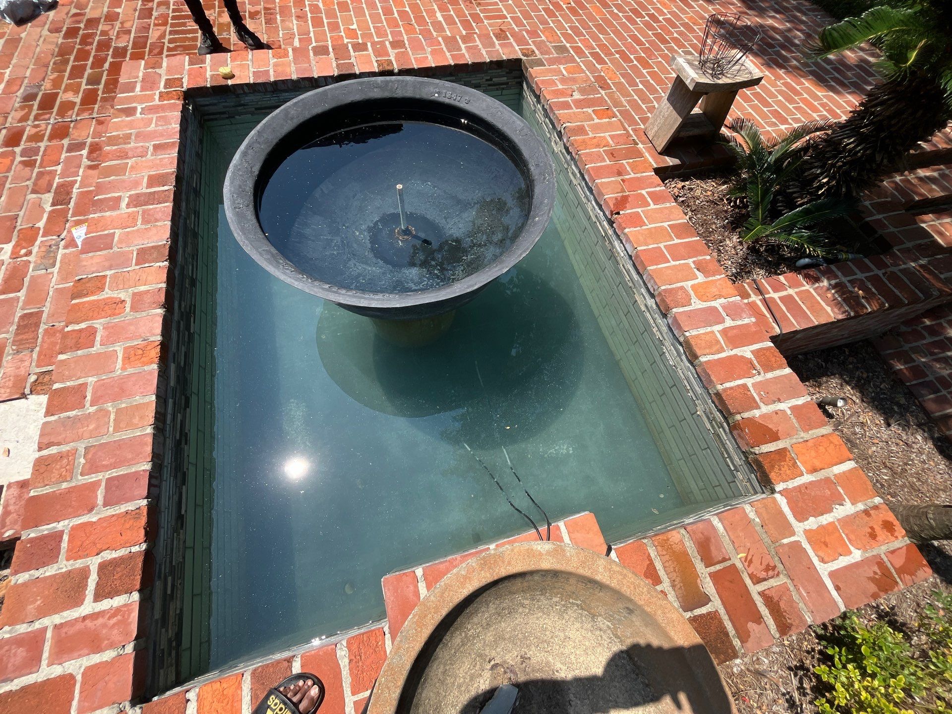 Pool Cleaning using Pool Cleaner by College Bros Outdoor services
