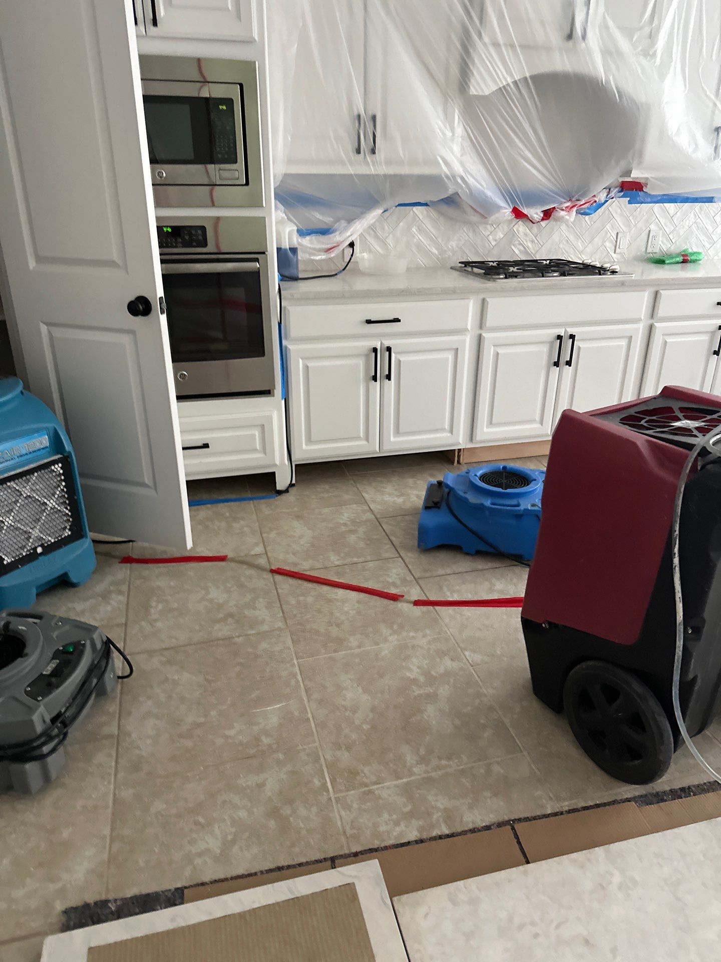 Kitchen Remodel using Water mitigation equipment by L&T General Contractors and Restoration INC