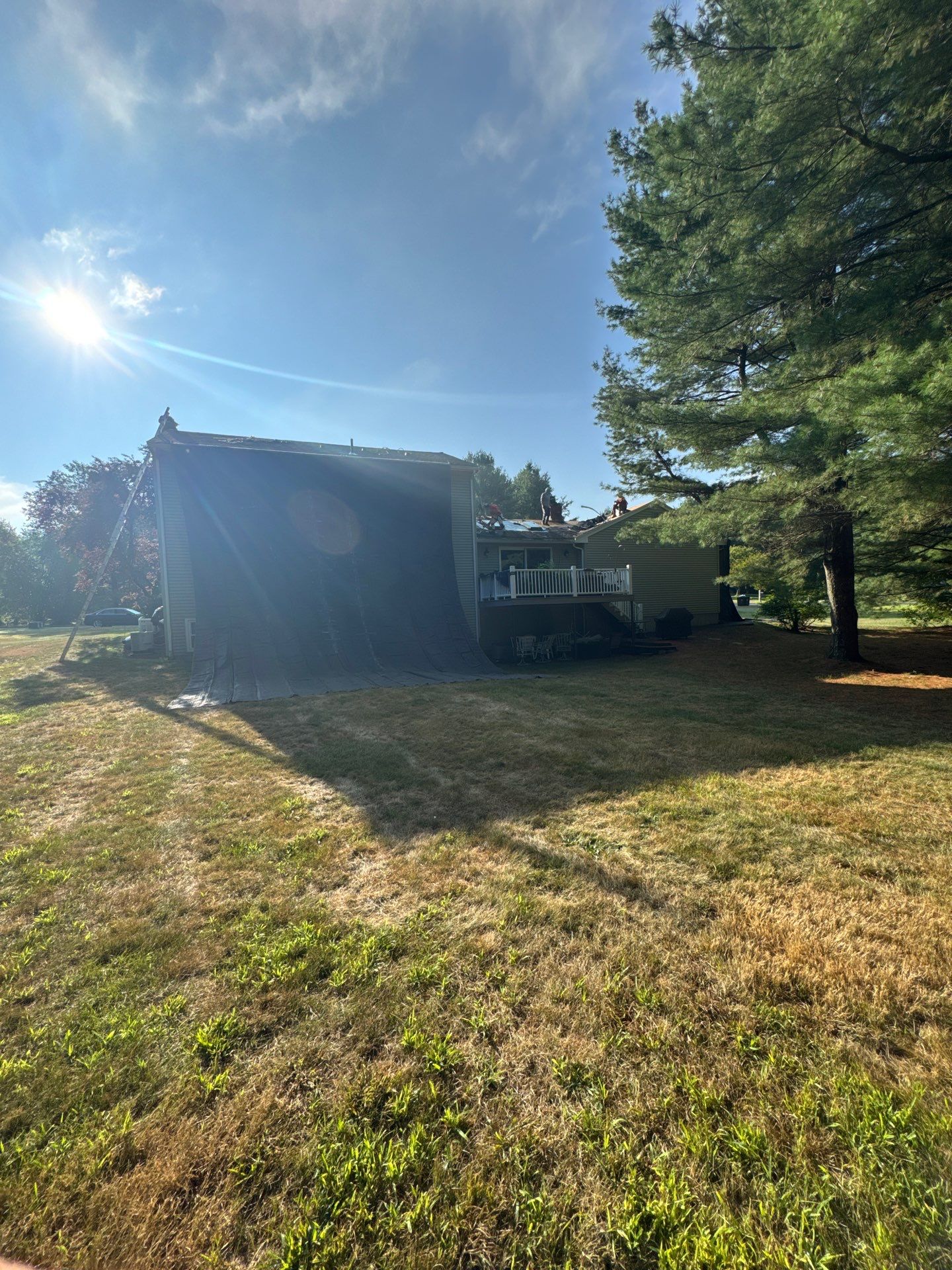 Complete Roof Replacement with Chimney Flashing, Gutter Guard System, and Vinyl Siding Repairs by Mighty Dog Roofing of Greater Middlesex County
