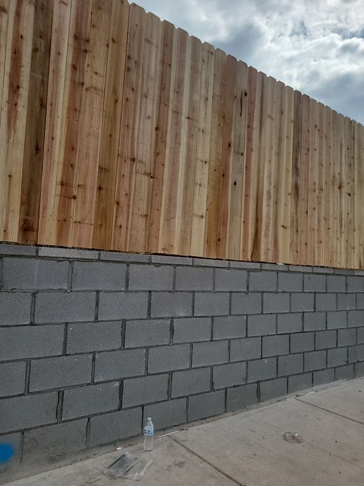 Cedar Fence using Cedar Pickets and Metal Poles by Clays Services Inc