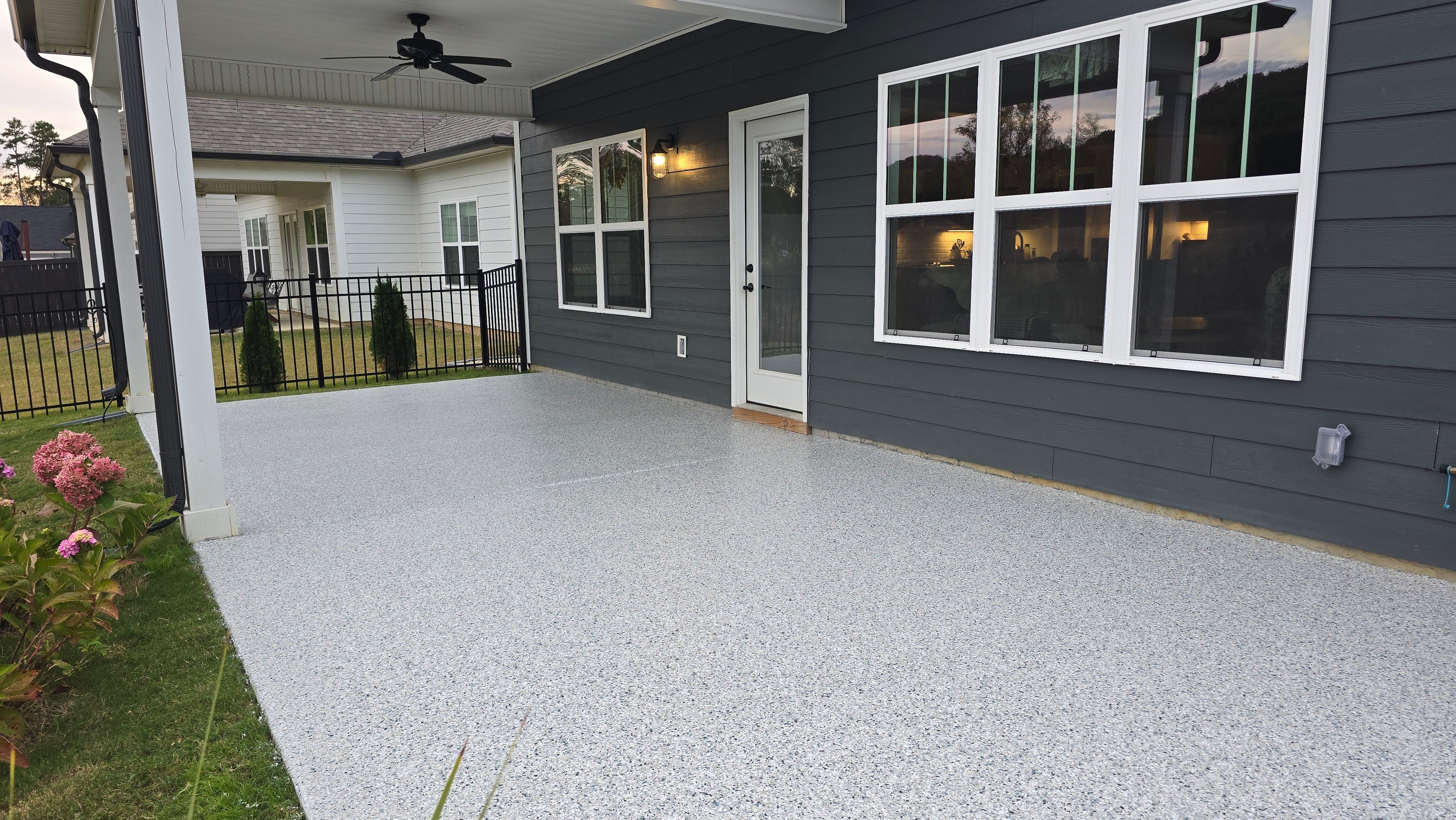Sidewalk, Porch, and Back Patio Using Creekbed and Nordic Green by Elite Floor Solutions