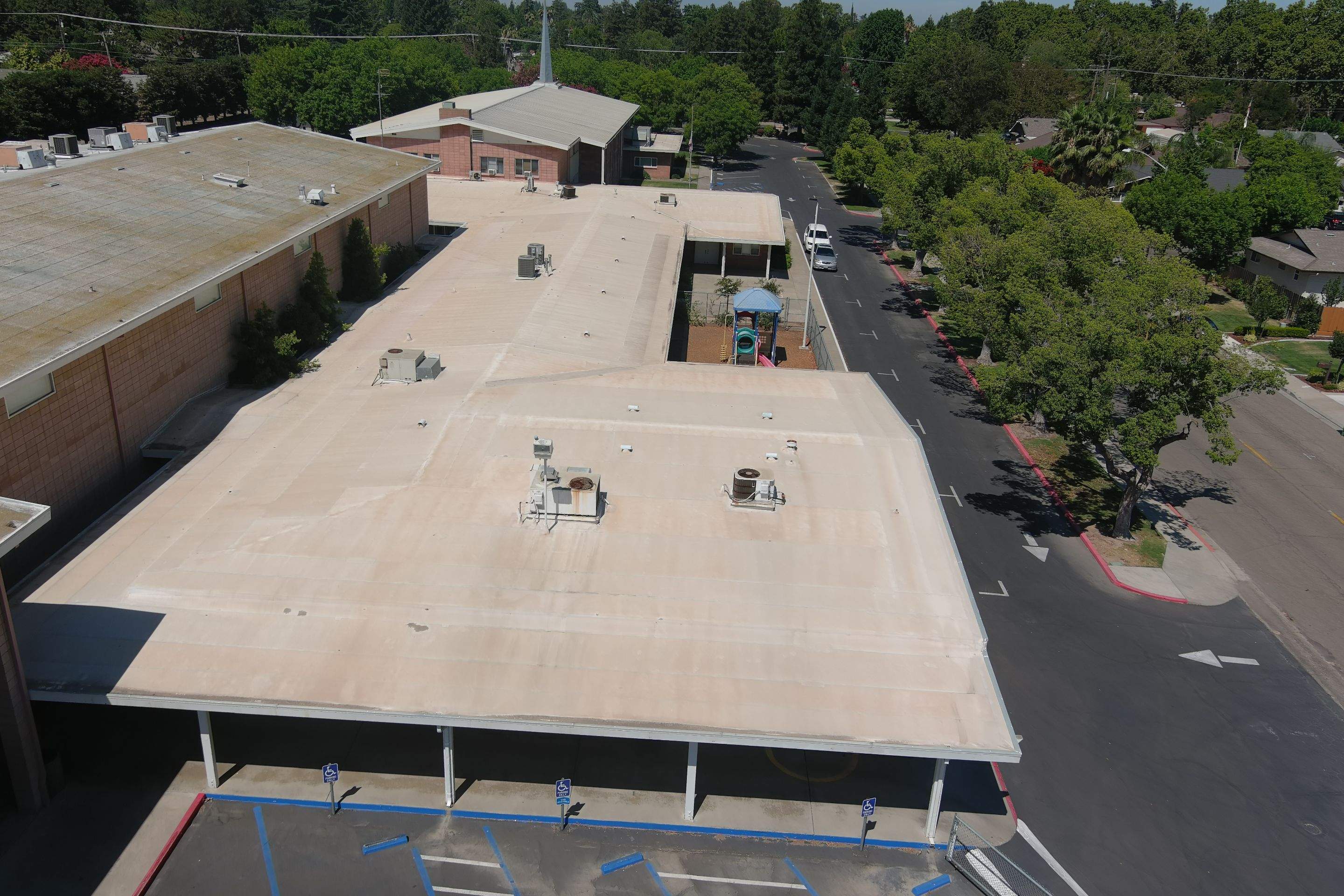 MR Roofing system using Benchmark/PUMA XL coatings over TPO single-ply roofing by Straight Edge Roofing Inc