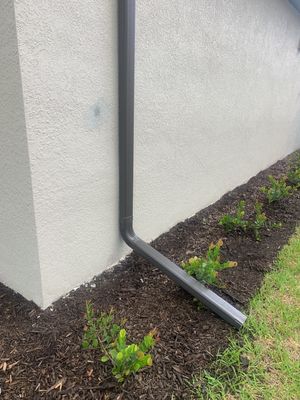 Seamless brown gutter and downspouts installation in Estero, FL 