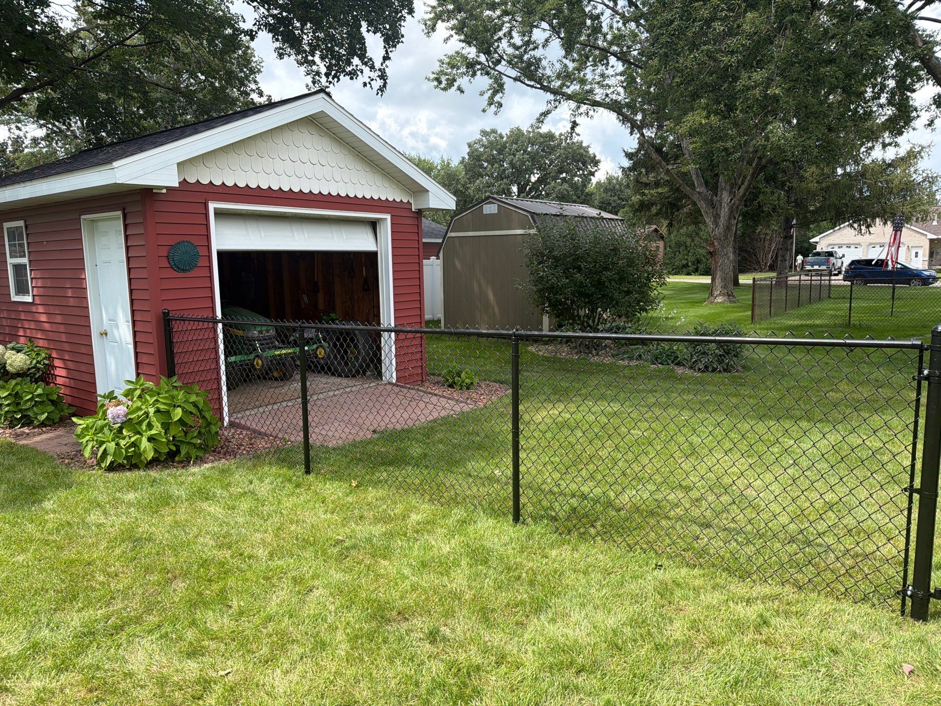Residential White Vinyl Privacy and Black Chain Link Fencing in Jesup by Perfect Picket Fence and Stain